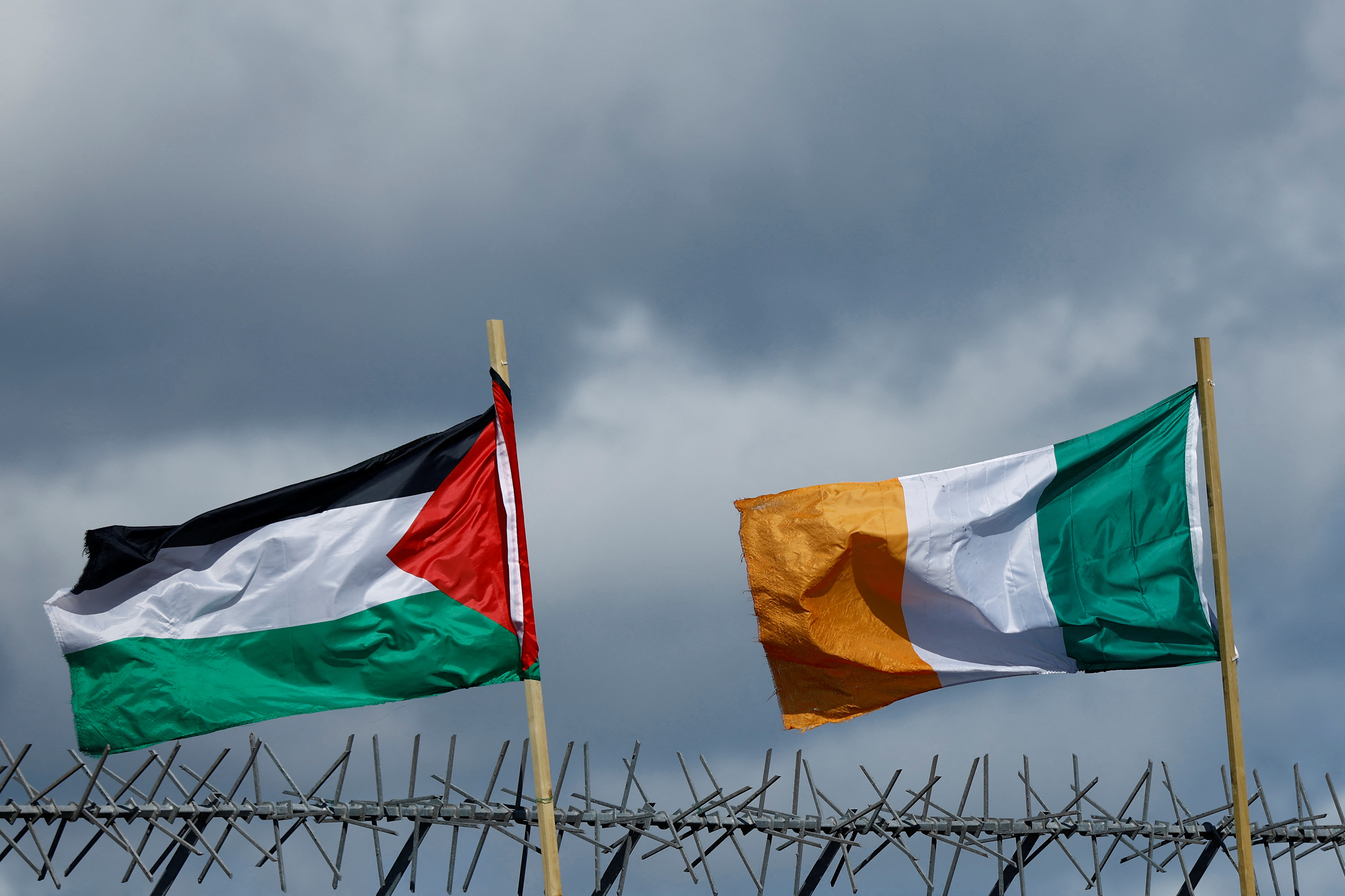 Flags of Palestine and Ireland flutter next to each other over the International Wall in support of Gaza, amid the ongoing conflict between Israel and the Palestinian Islamist group Hamas, in Belfast, Northern Ireland