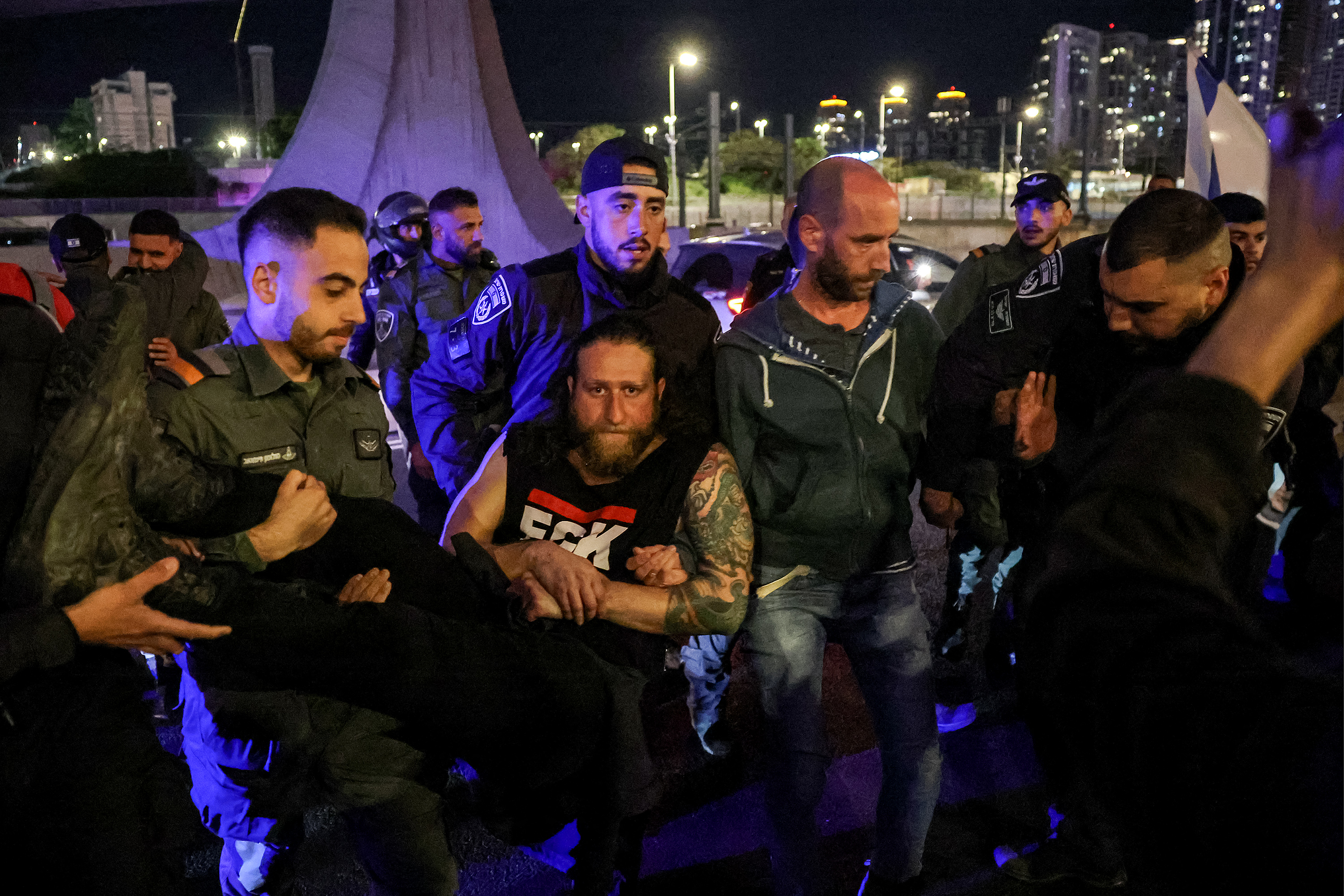 Israeli police forcibly remove protesters from an anti-government demonstration in Tel Aviv on March 1