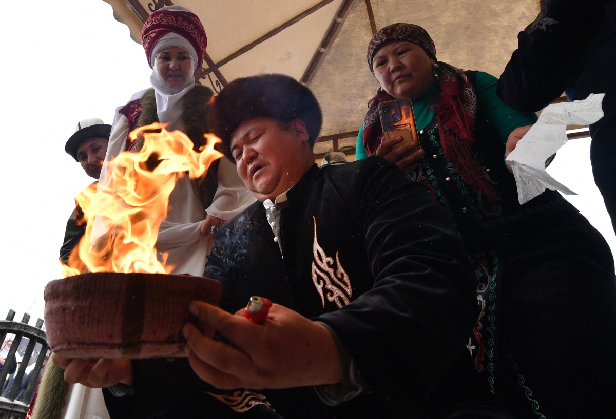 Performers wearing traditional costumes take part in the celebrations of Nowruz
