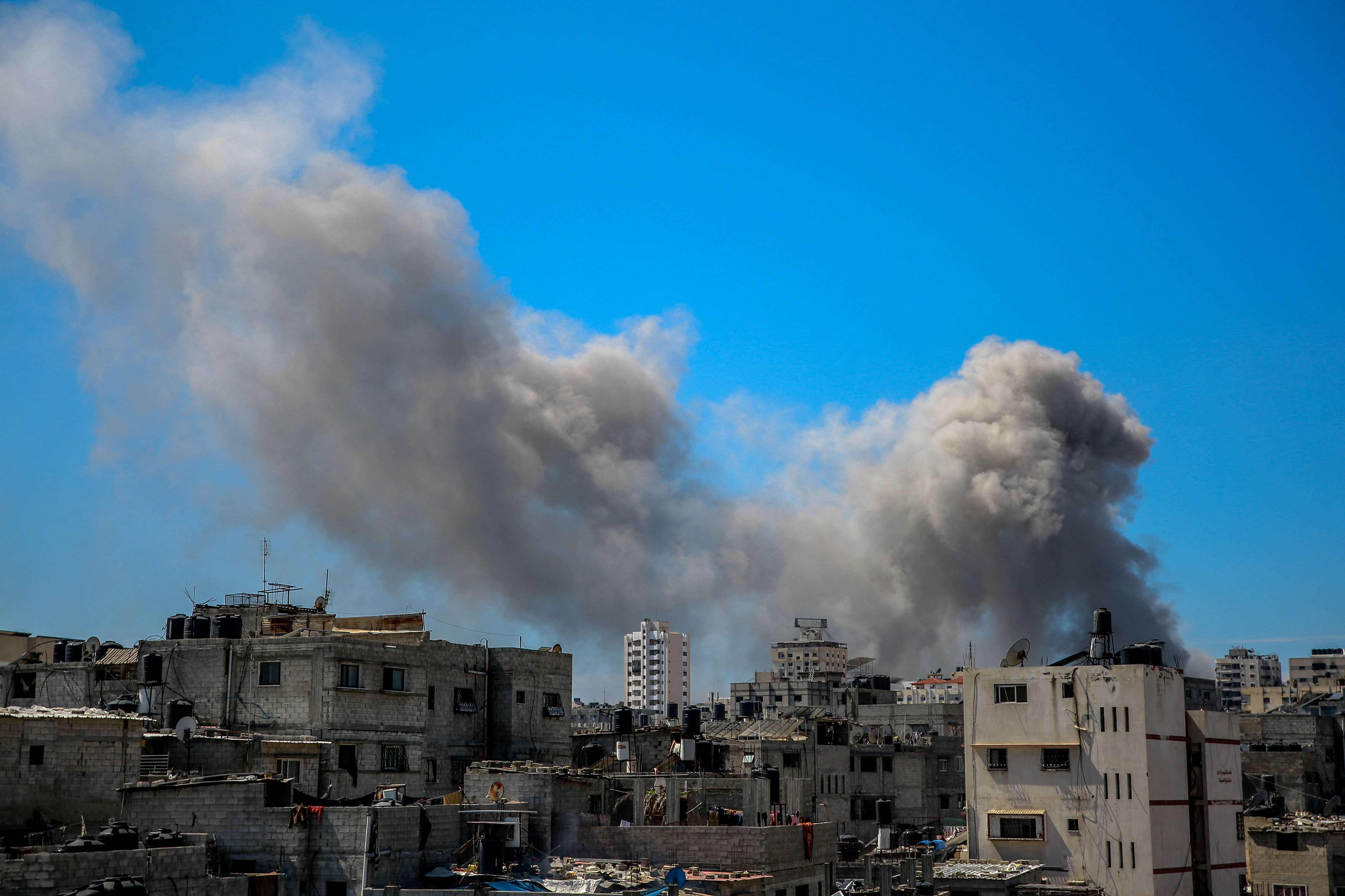 A picture shows smoke billowing after Israeli bombardment in the vicinity of the Al-Shifa hospital in Gaza City on March 23, 2024, amid ongoing battles between Israel and the militant group Hamas. (Photo by AFP) / The erroneous mention[s] appearing in the metadata of this photo by - has been modified in AFP systems in the following manner: [March 23] instead of [March 21]. Please immediately remove the erroneous mention[s] from all your online services and delete it (them) from your servers. If you have been authorized by AFP to distribute it (them) to third parties, please ensure that the same actions are carried out by them. Failure to promptly comply with these instructions will entail liability on your part for any continued or post notification usage. Therefore we thank you very much for all your attention and prompt action. We are sorry for the inconvenience this notification may cause and remain at your disposal for any further information you may require.