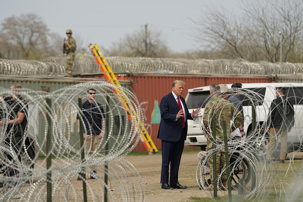 Republican presidential candidate former President Donald Trump talks with Maj. Gen. Thomas Suelzer, Adjutant General for the State of Texas, at Shelby Park during a visit to the US-Mexico border, Thursday, February 29, 2024