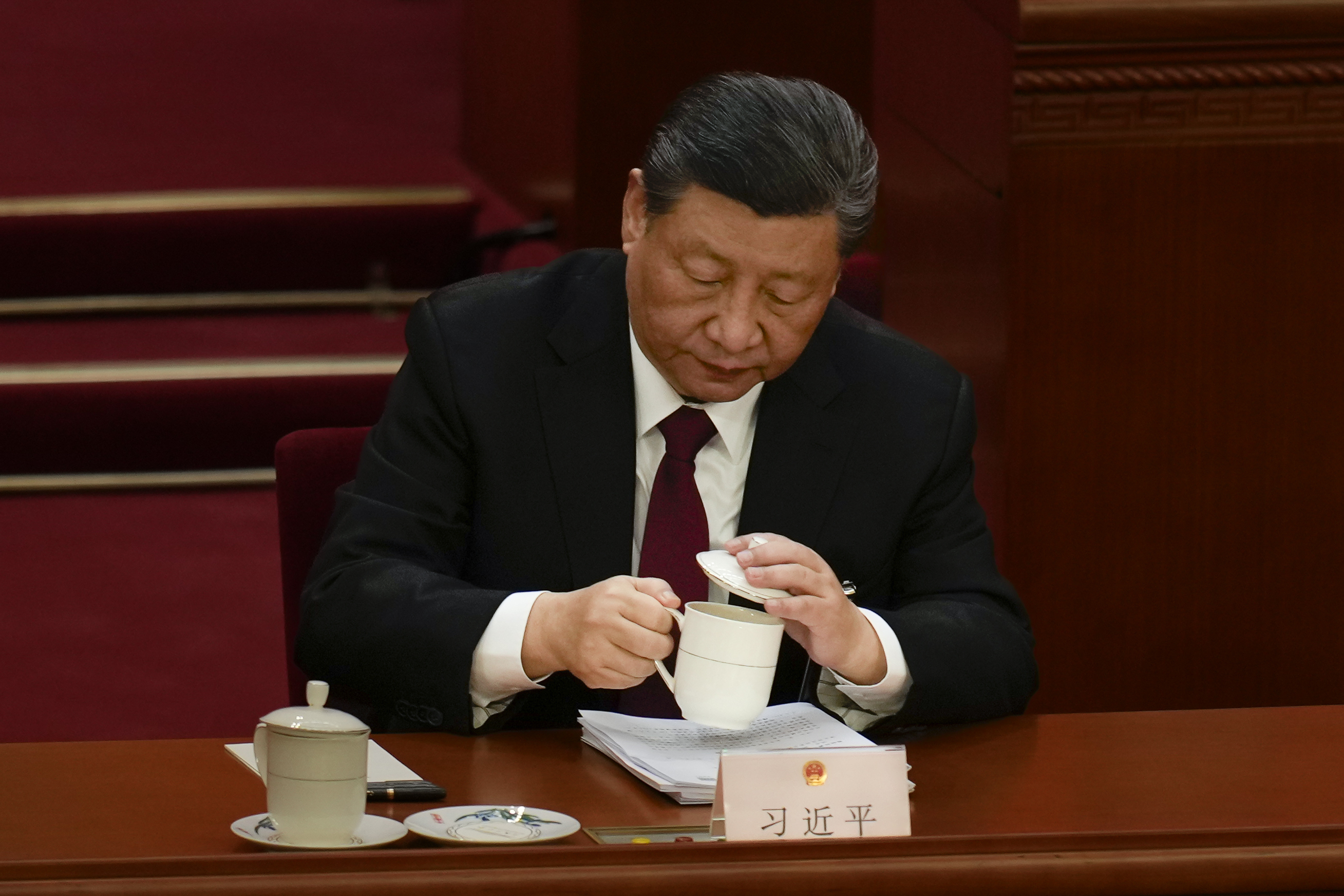Chinese President Xi Jinping drinks a cup of tea during the opening session of the National People's Congress (NPC) at the Great Hall of the People in Beijing, China, Tuesday, March 5
