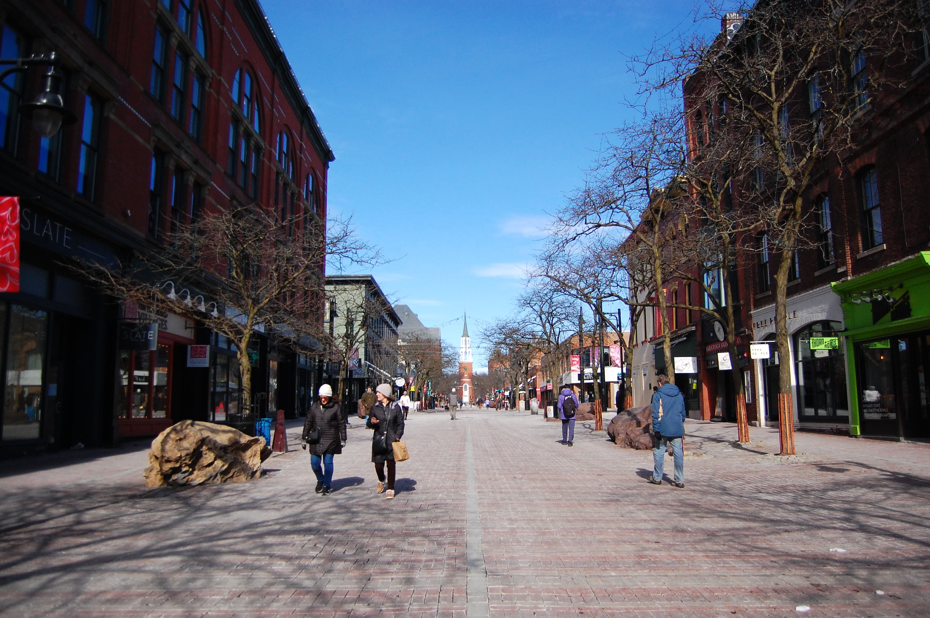 People walk on Church Street in downtown Burlington, Vermont, US