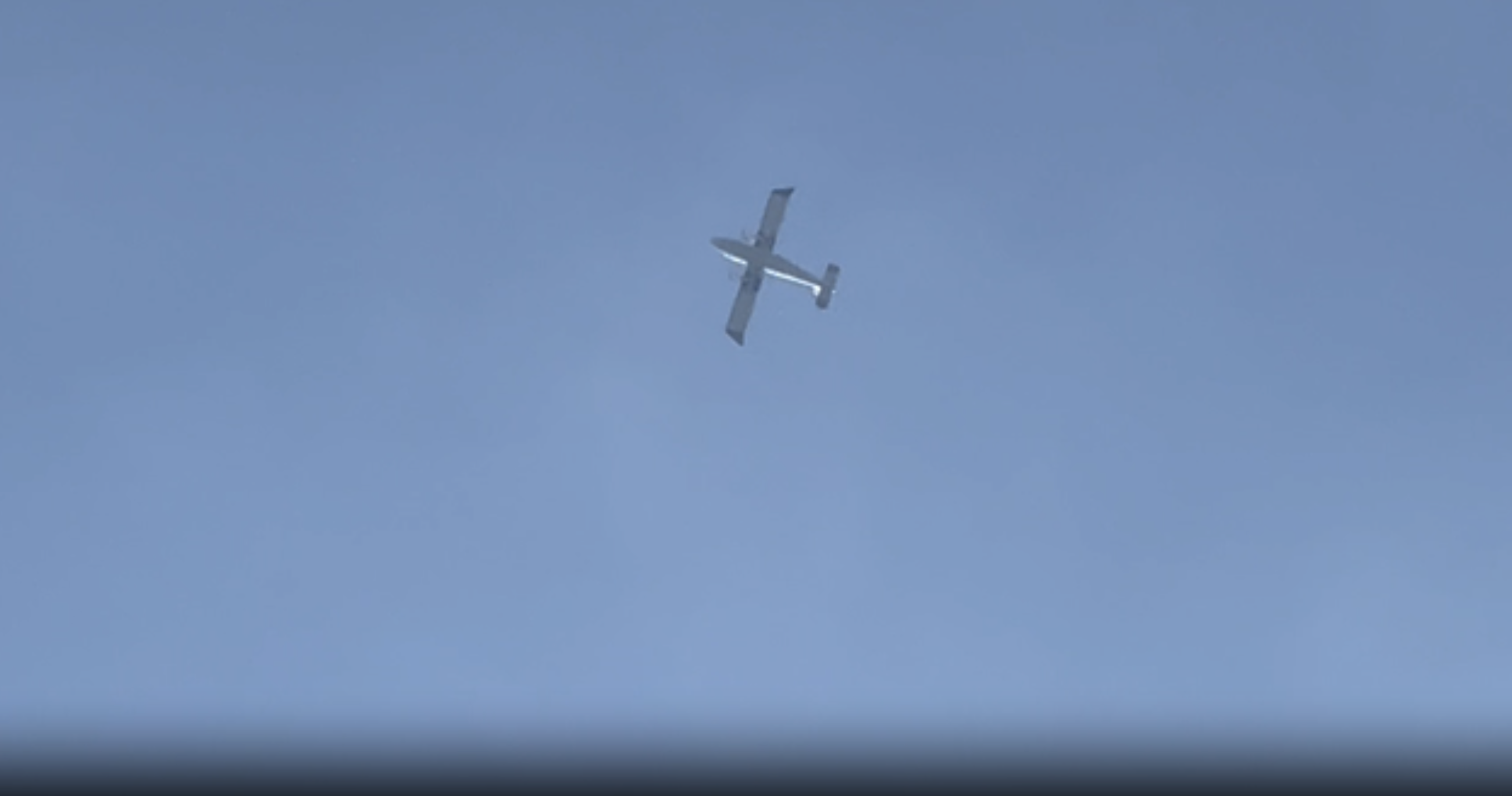A Myanmar military spy plane in the air above Kayah state