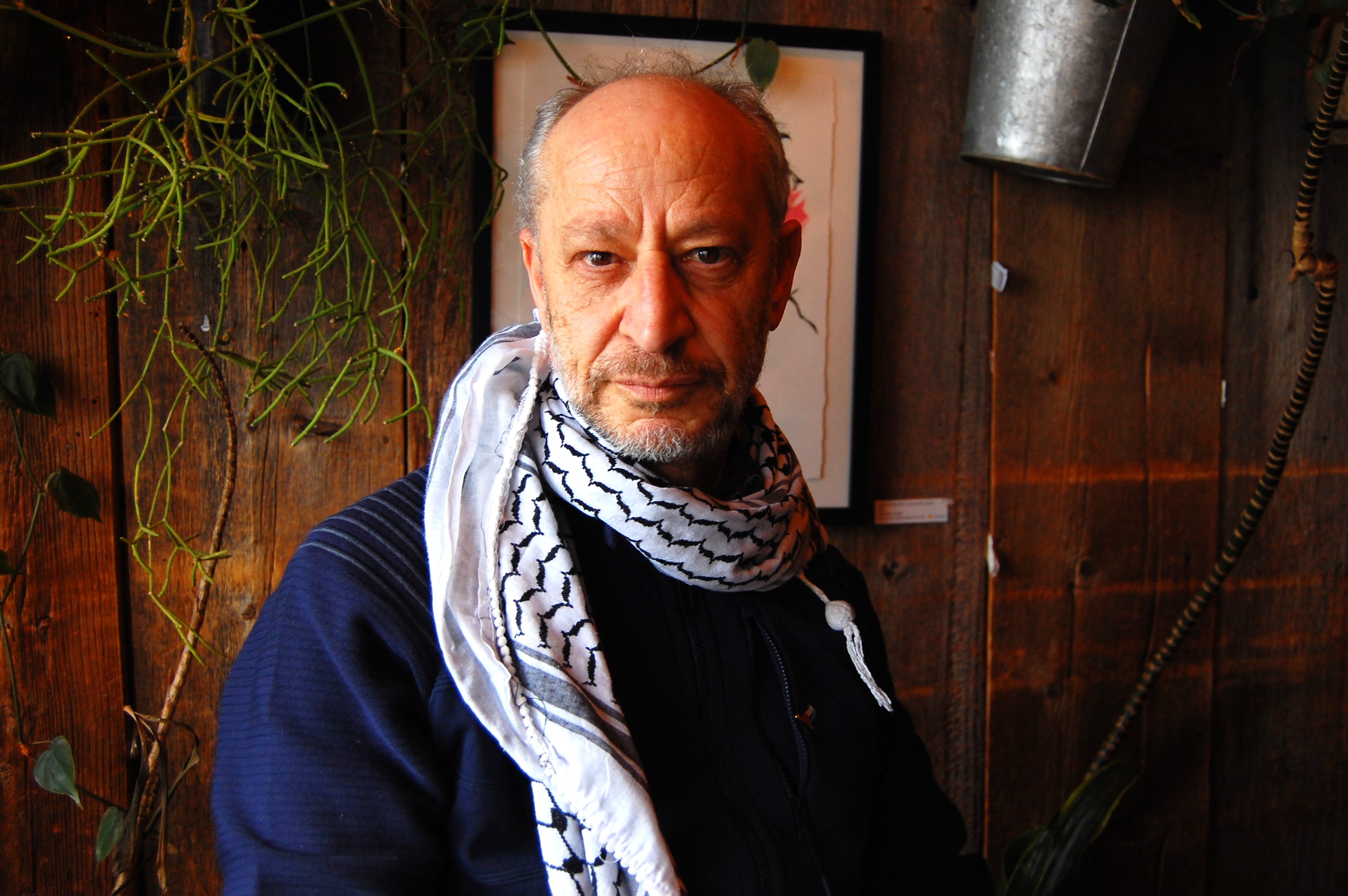 Wafic Faour, a Palestinian refugee and activist with Vermonters for Justice in Palestine, poses for a photo at a cafe in Burlington, Vermont, US