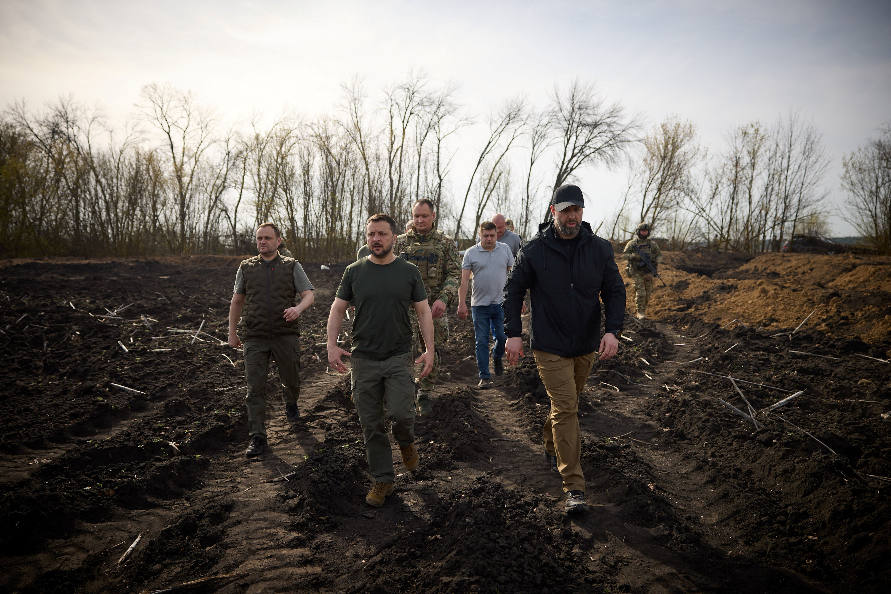 Ukraine's President Volodymyr Zelenskiy and Head of Kharkiv Regional-Military Administration Oleh Syniehubov inspect new fortifications for Ukrainian servicemen, amid Russia's attack on Ukraine, near Russian border in Kharkiv region, Ukraine, April 9, 2024. Ukrainian Presidential Press Service/Handout via REUTERS ATTENTION EDITORS - THIS IMAGE HAS BEEN SUPPLIED BY A THIRD PARTY.