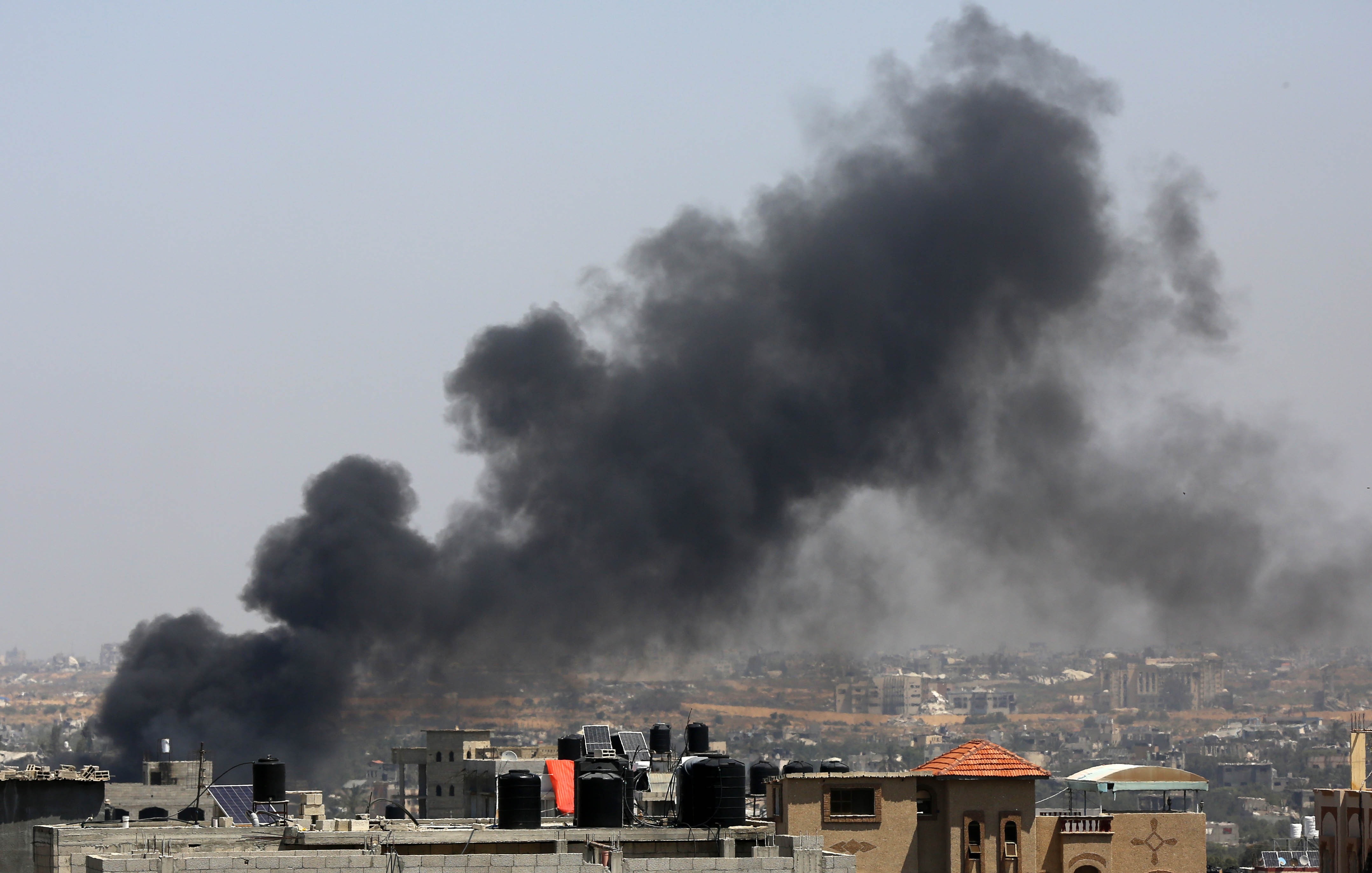 Smoke rises as the Israeli forces raid the Nuseirat refugee camp in Deir Al Balah, Gaza on April 12
