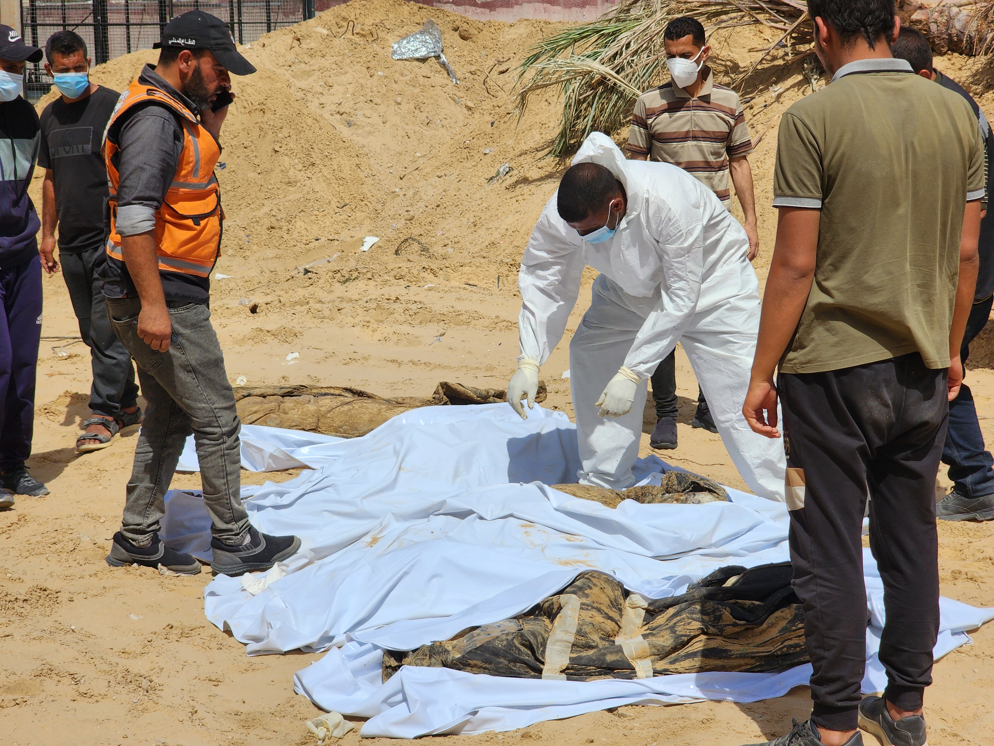 Civil Defense teams uncover 51 more bodies on Wednesday from a mass grave at Nasser