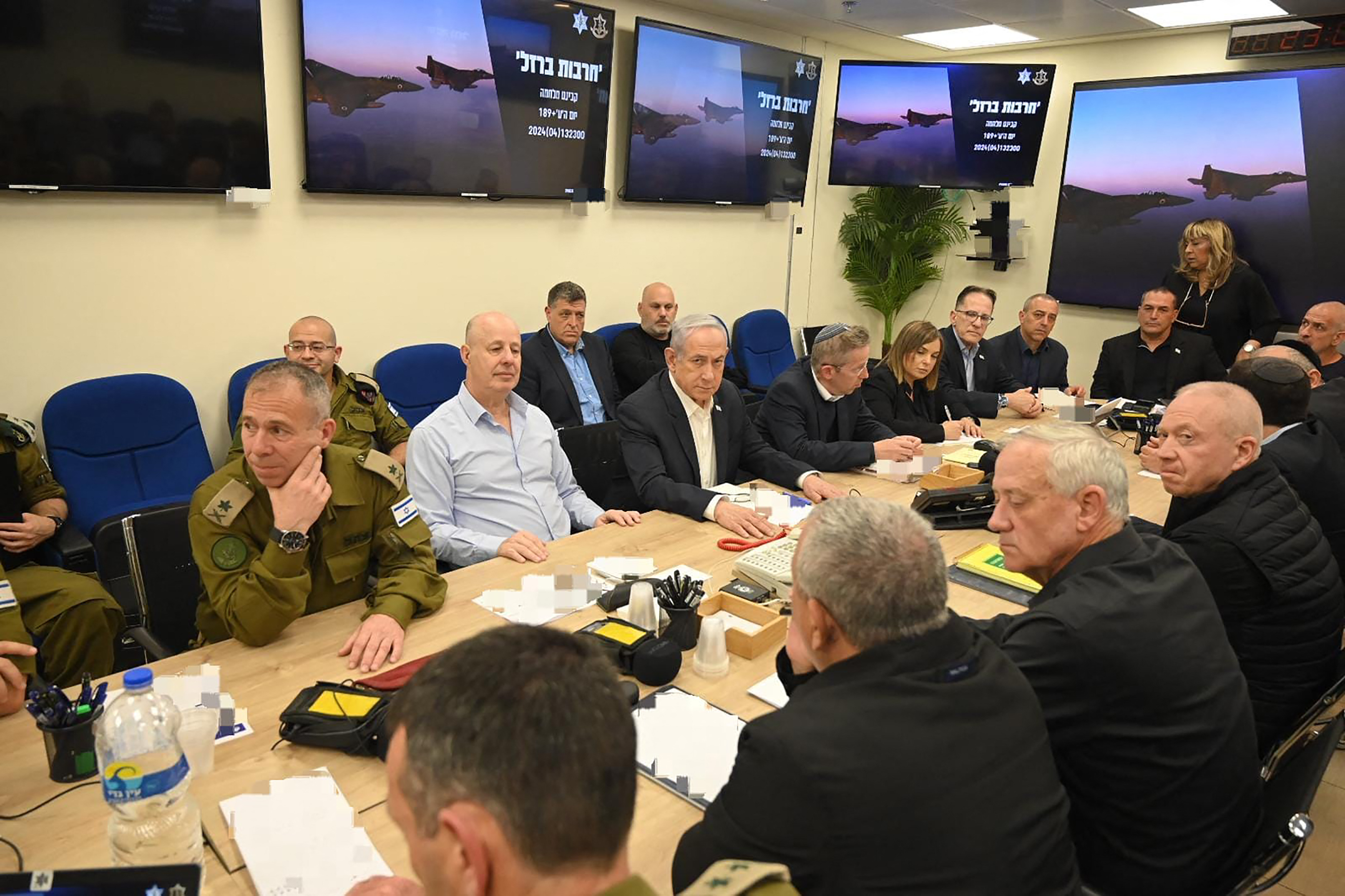 Israel's Prime Minister Benjamin Netanyahu (C) during a War Cabinet meeting at the Kirya in Tel Aviv