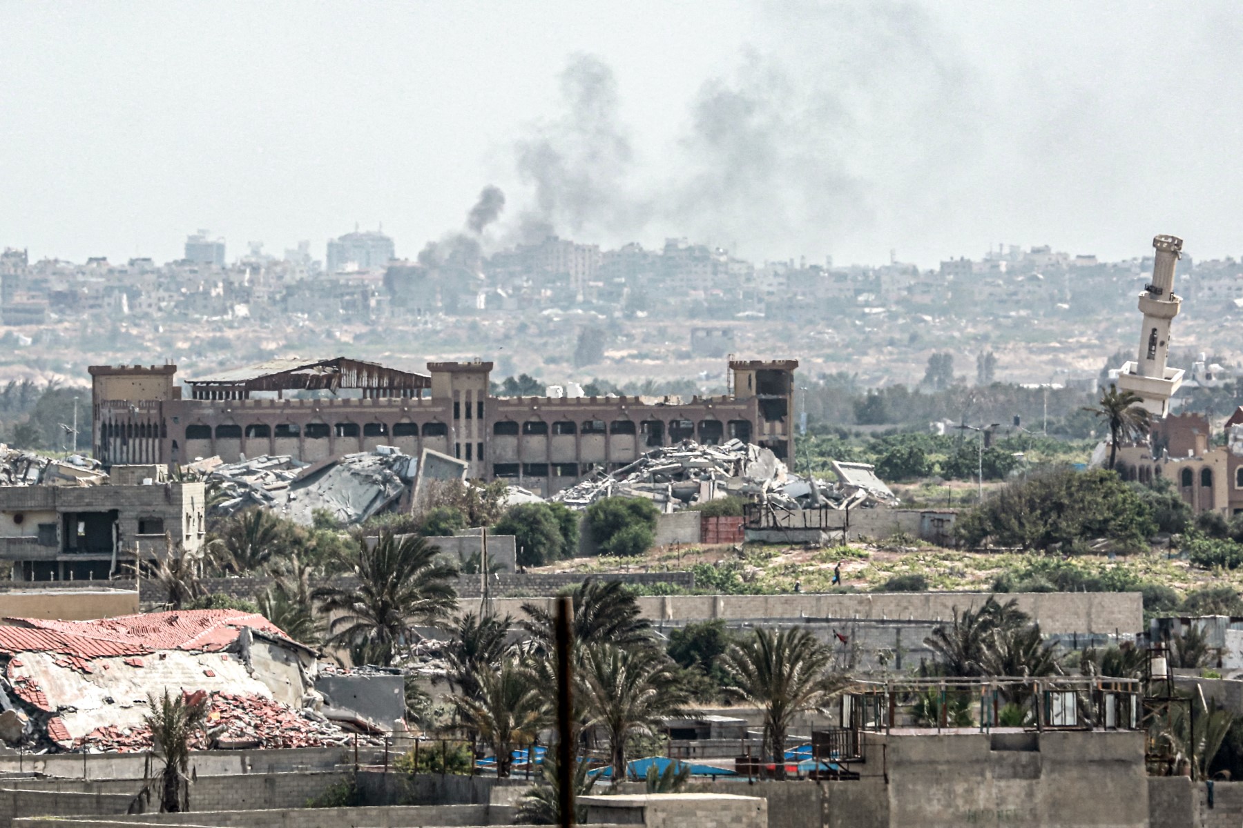 Smoke plumes billow following Israeli bombardment north of Nuseirat in the central Gaza Strip