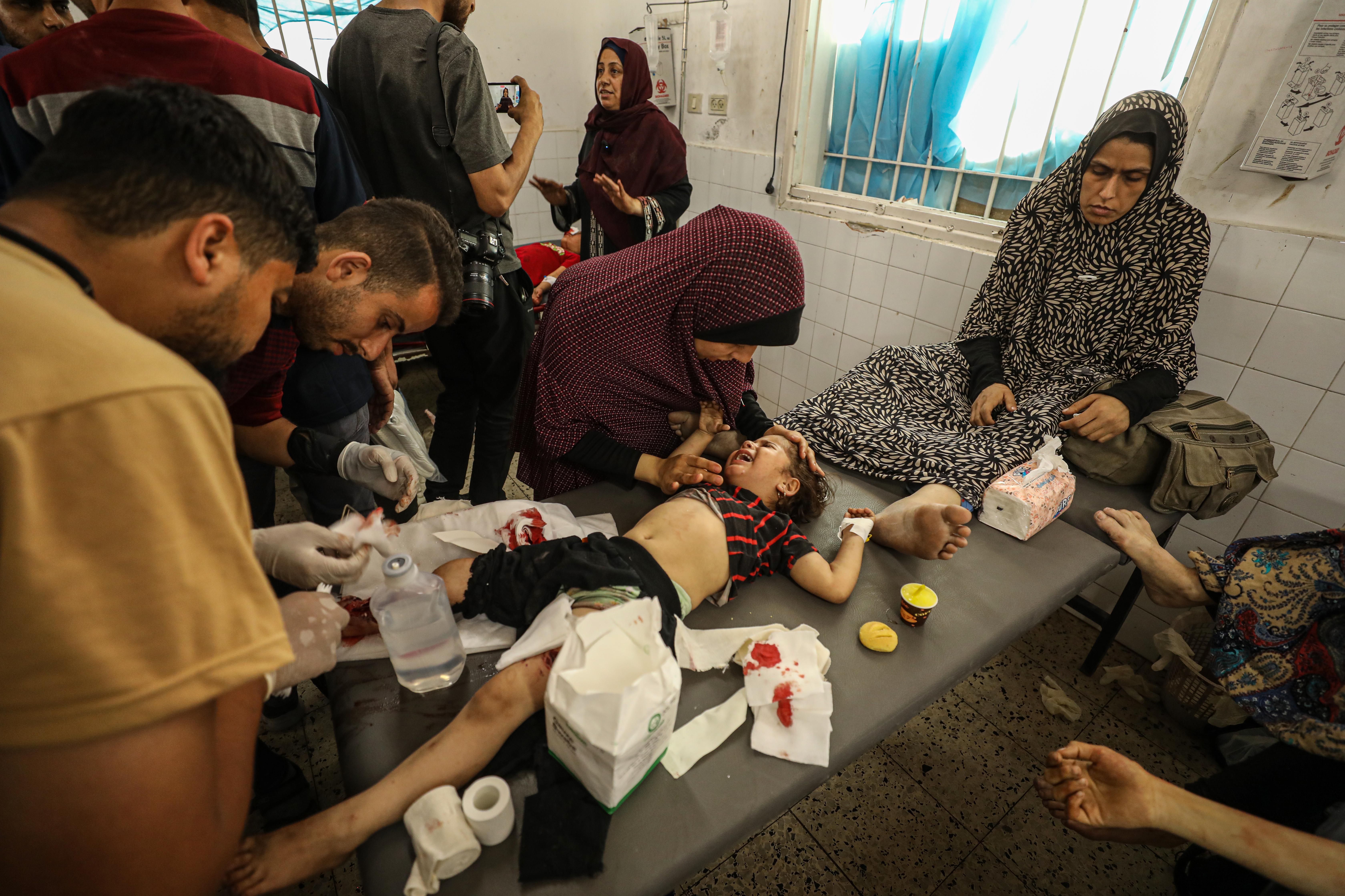 The wounded, including children, are brought to Al-Ahli Baptist Hospital in Gaza City, Gaza after the Israeli army attacked the Al-Nazla school building, where displaced Palestinians were sheltering in the Saftawi neighborhood, on May 25