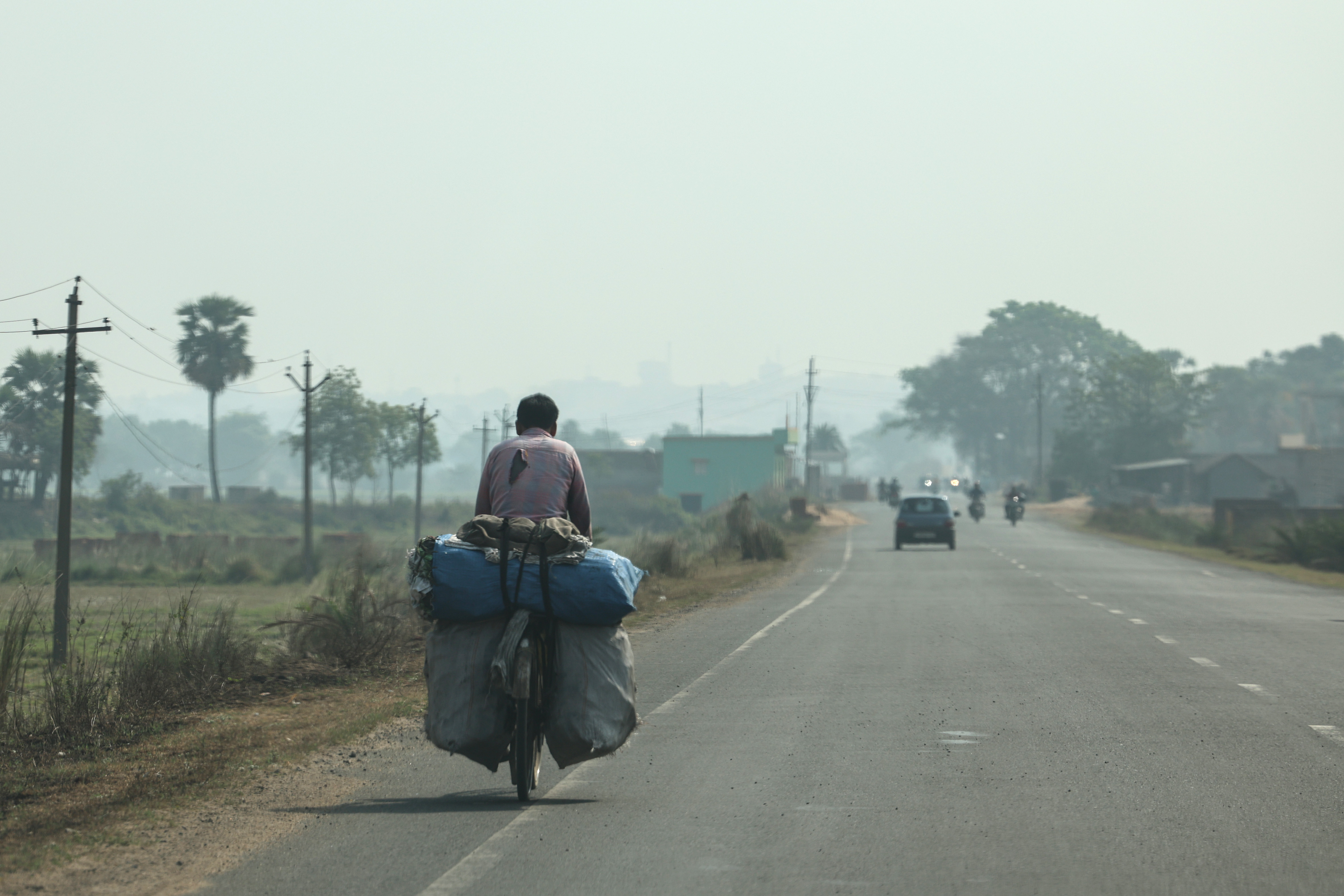 A man allegedly carries sacks of illegally mined coal on a bicycle in the Asansol-Raniganj belt in West Bengal