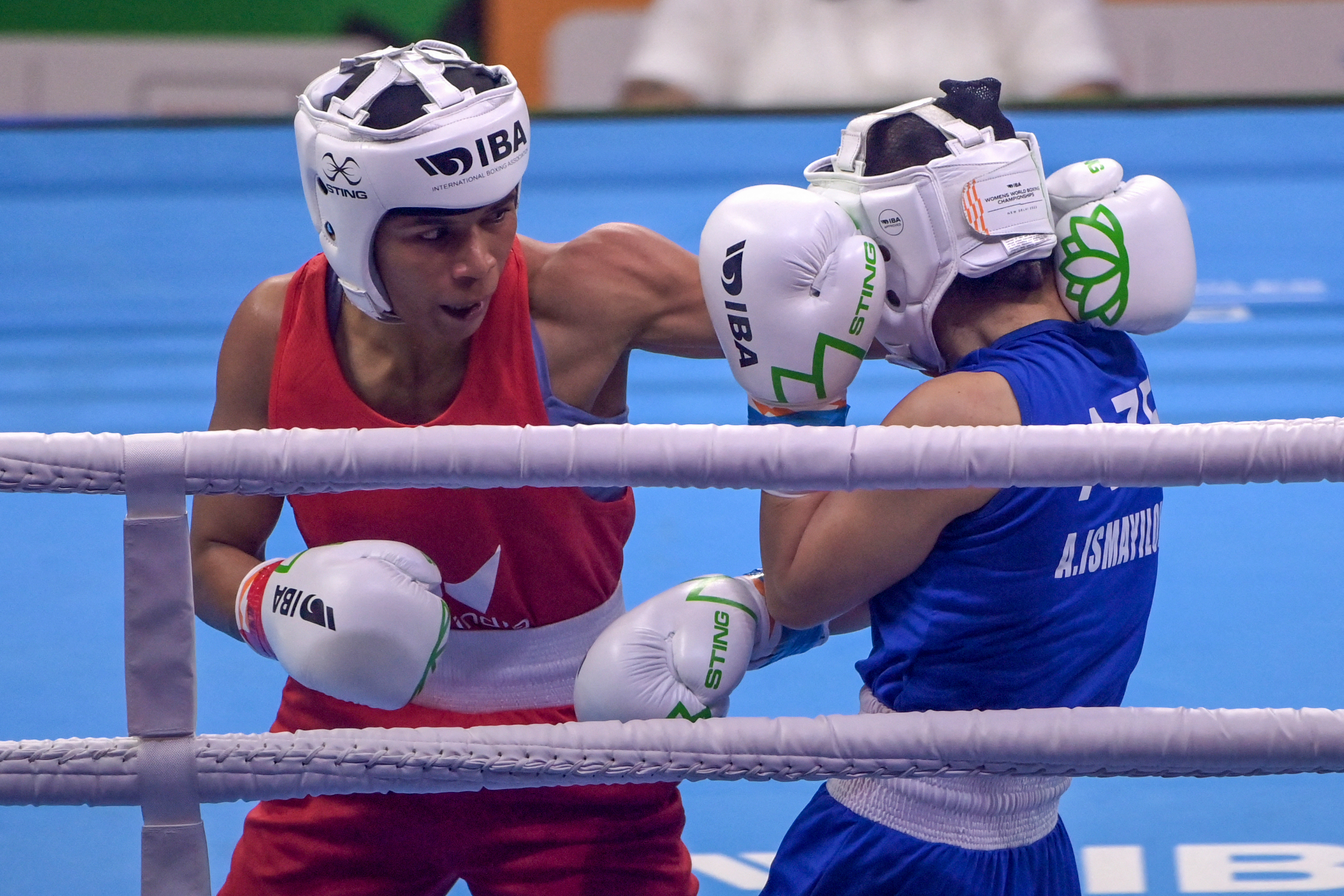 Nikhat Zareen throws punch in boxing ring.