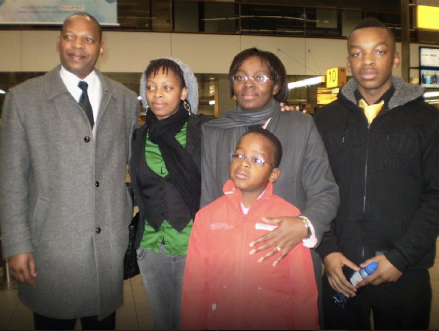 Victoire Ingabire Umuhoza poses for a photo with her husband and three children at the Amsterdam Schiphol airport in the Netherlands before getting on the plane to Kigali in January, 2010. This was the last time she was together with her entire family. [Photo courtesy of Victoire Ingabire Umuhoza]