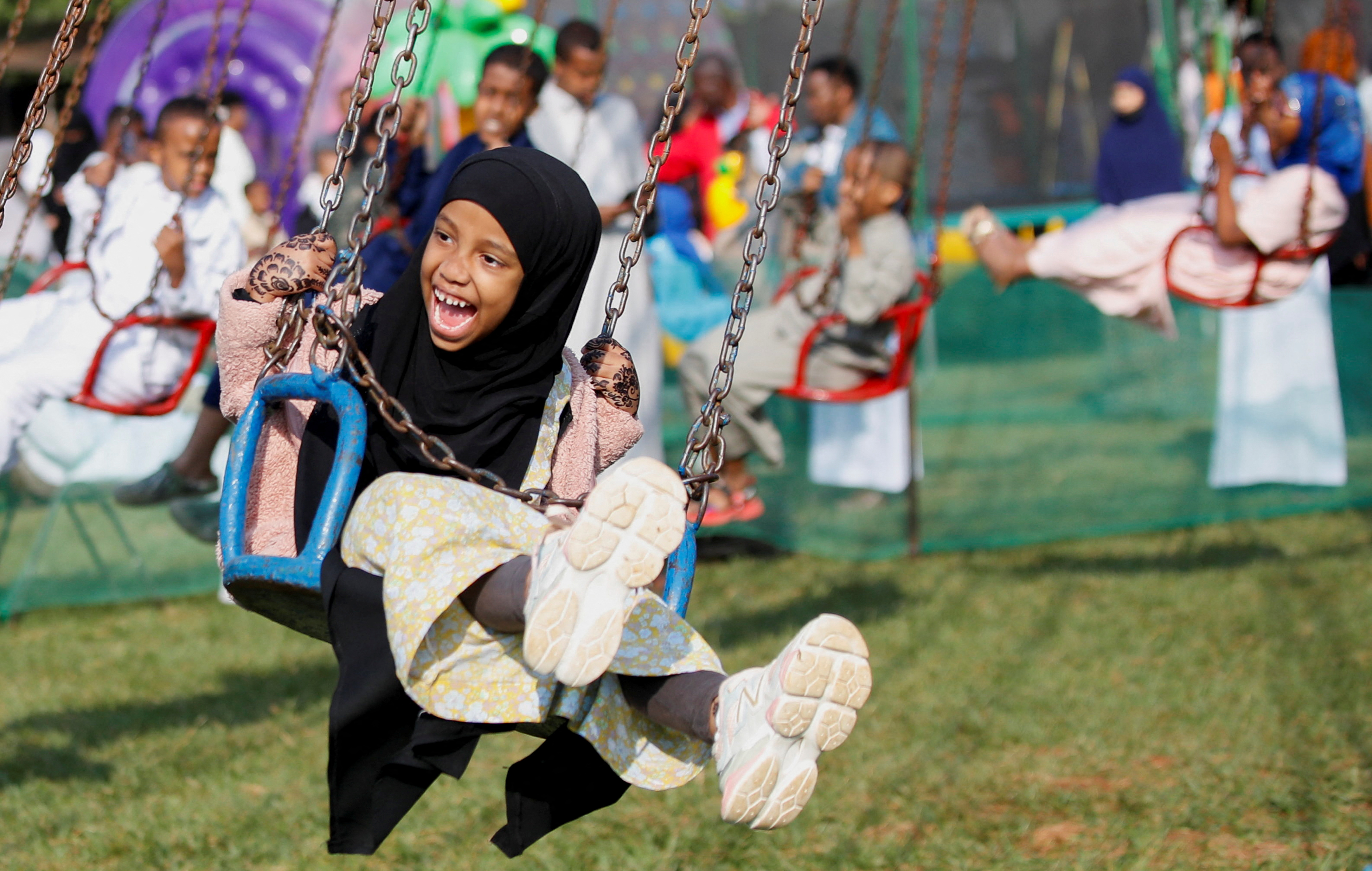Muslim children play during celebrations marking the Muslim holiday of Eid al-Adha after attending prayers at the Sir Ali Muslim Club Ground in Nairobi, Kenya