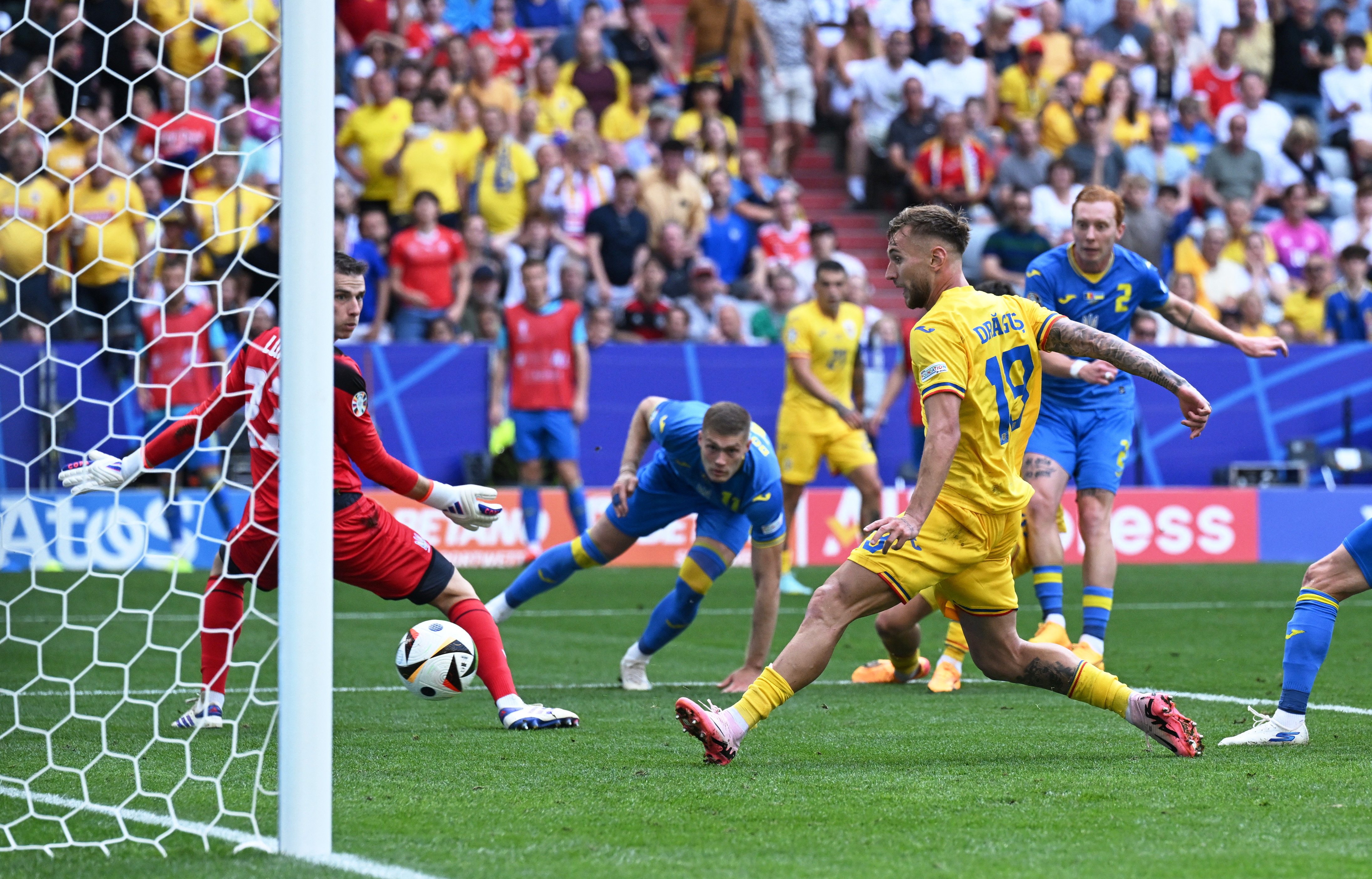 Football player kicks goal.