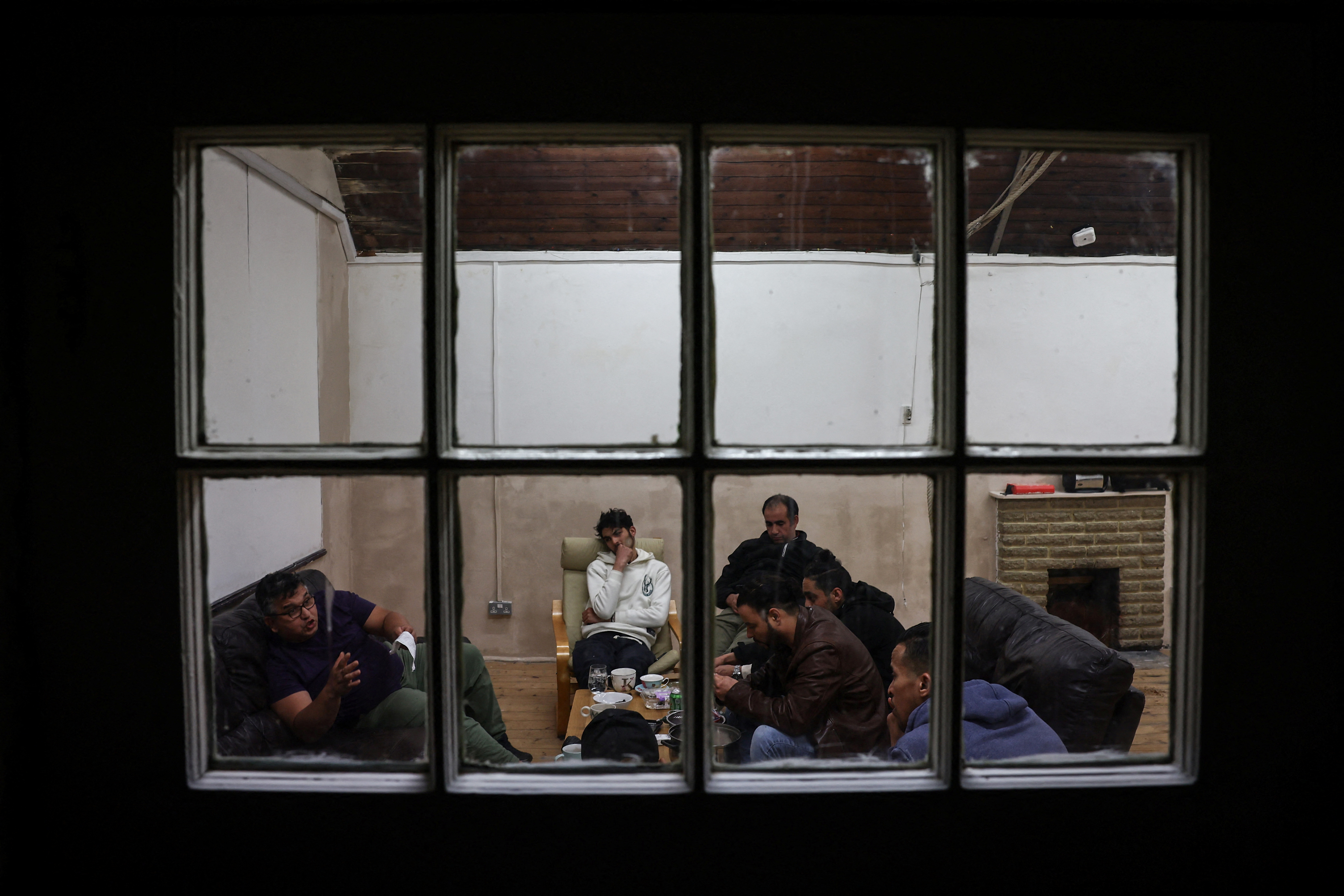 Squatters rest in a room used as a common room of the place they live, which was once a school and is now occupied by squatter activist group Reclaim Croydon, in Croydon, south London, Britain, May 16
