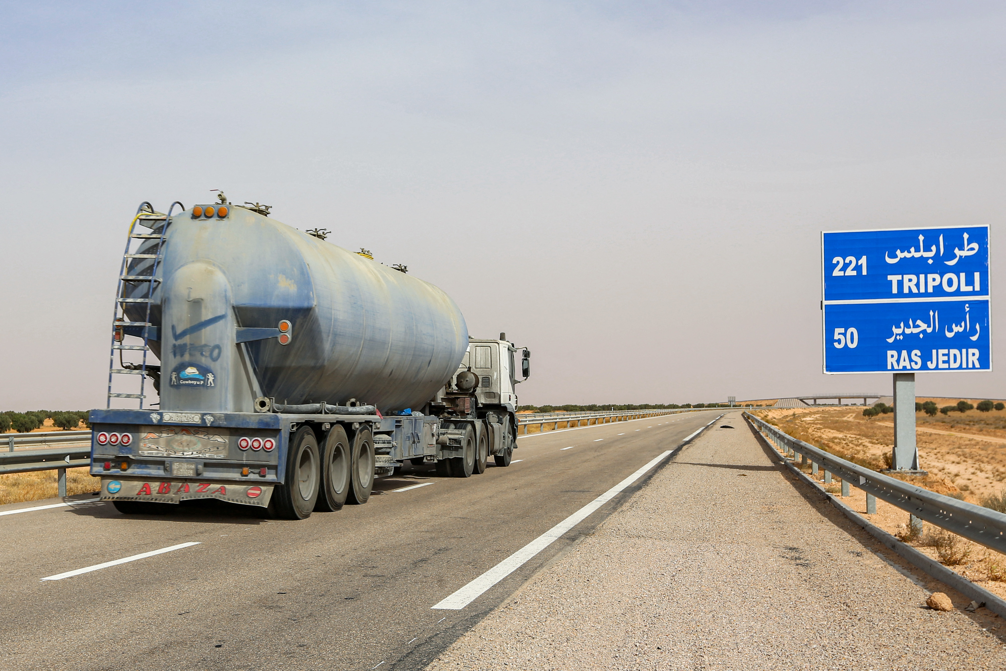 A fuel tanker truck drives along the international highway linking Tunisia's southern town of Ben Guerdane to Libya