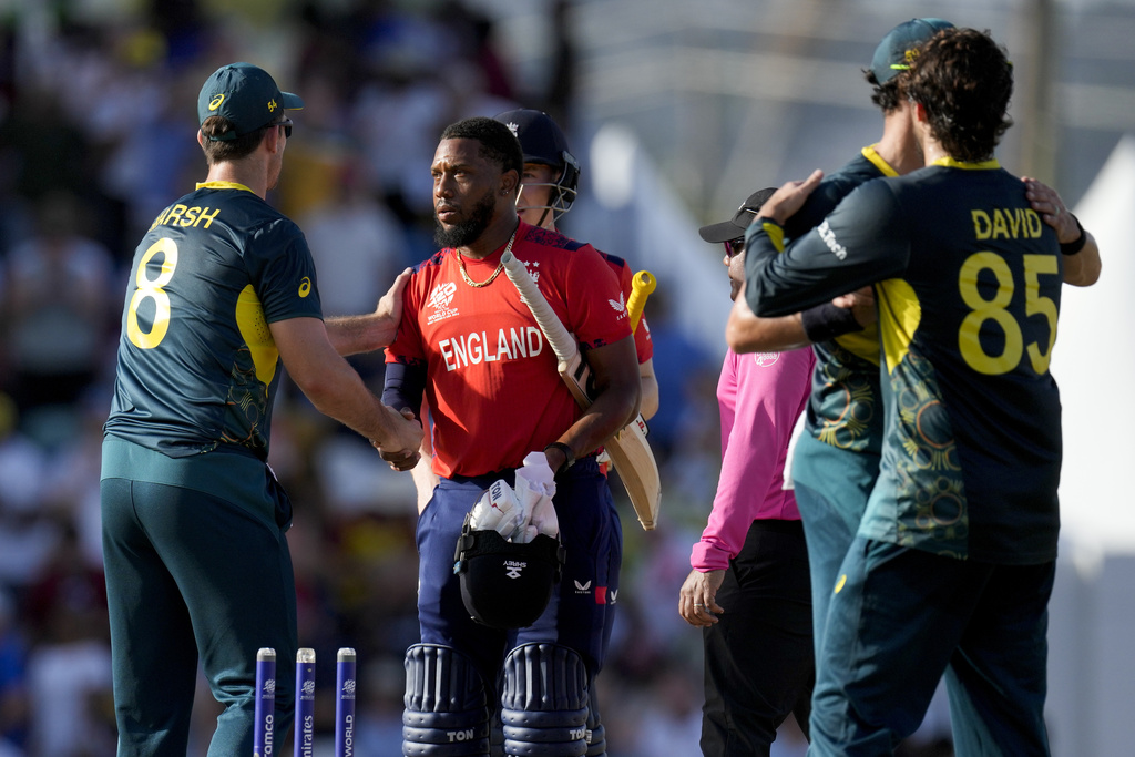 Australia's captain Mitchell Marsh greets England's Chris Jordan
