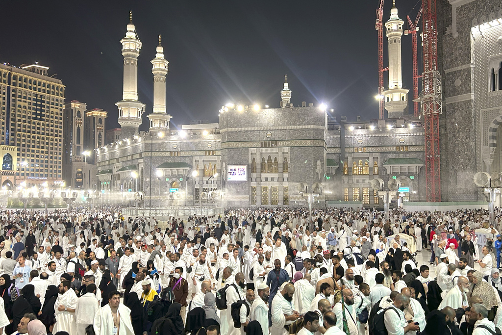 Pilgrims leave after offering prayers outside at the Grand Mosque during the annual Hajj pilgrimage in Mecca