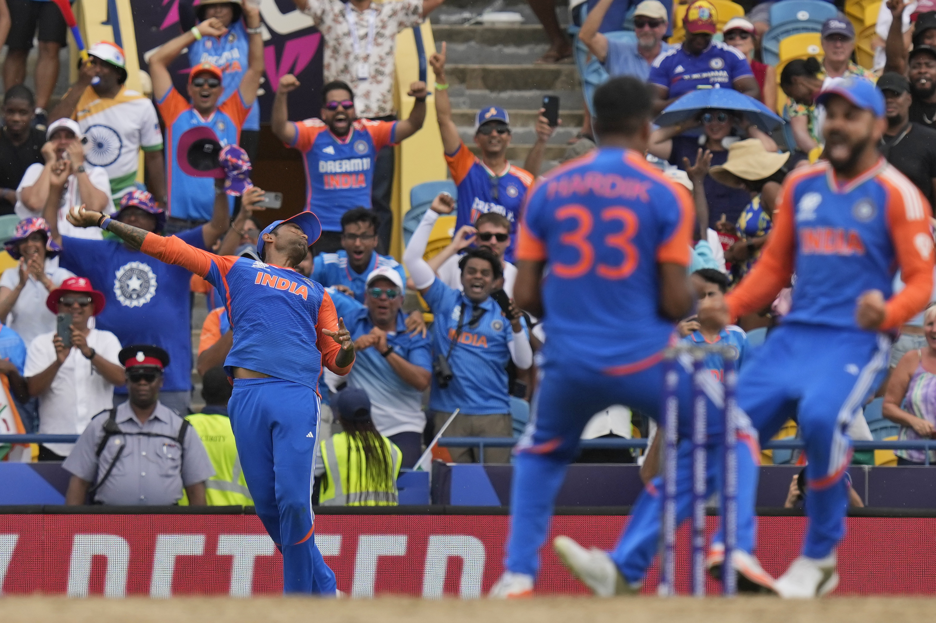 India's Suryakumar Yadav, left, takes the catch to get South Africa's David Miller out as teammates Virat Kohli, right, and Hardik Pandya celebrate during the ICC Men's T20 World Cup final cricket match between India and South Africa at Kensington Oval in Bridgetown, Barbados, Saturday, June 29, 2024. (AP Photo/Ramon Espinosa)
