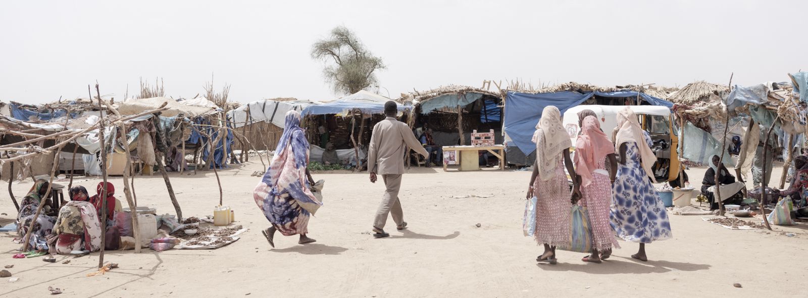 Daily life in Metche camp, where somewhere between 40,000 to 50,000 Sudanese refugees live after fleeing Darfur to eastern Chad.