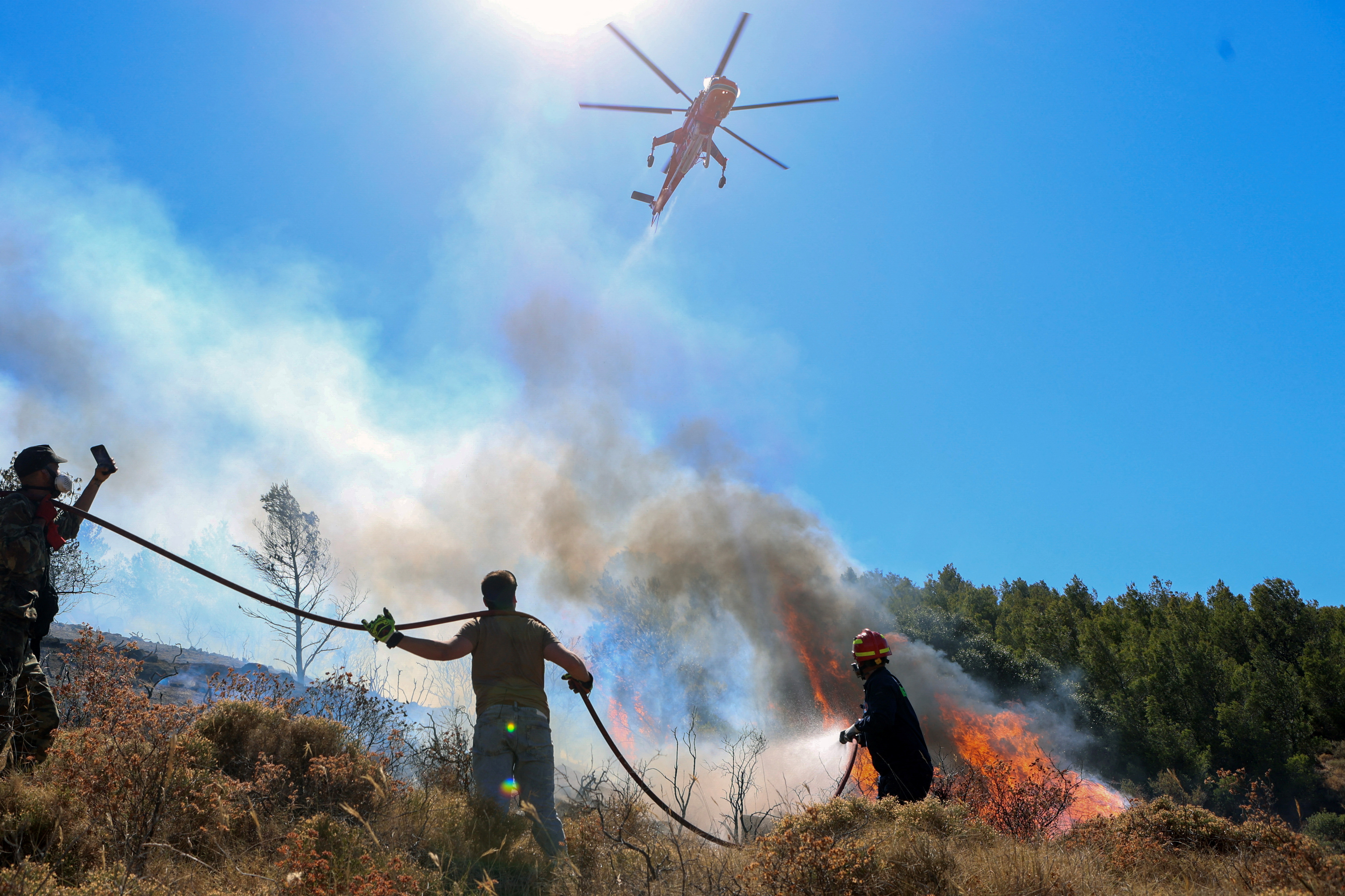 Firefighters were battling a series of wildfires near the Greek capital Athens on Sunday evening