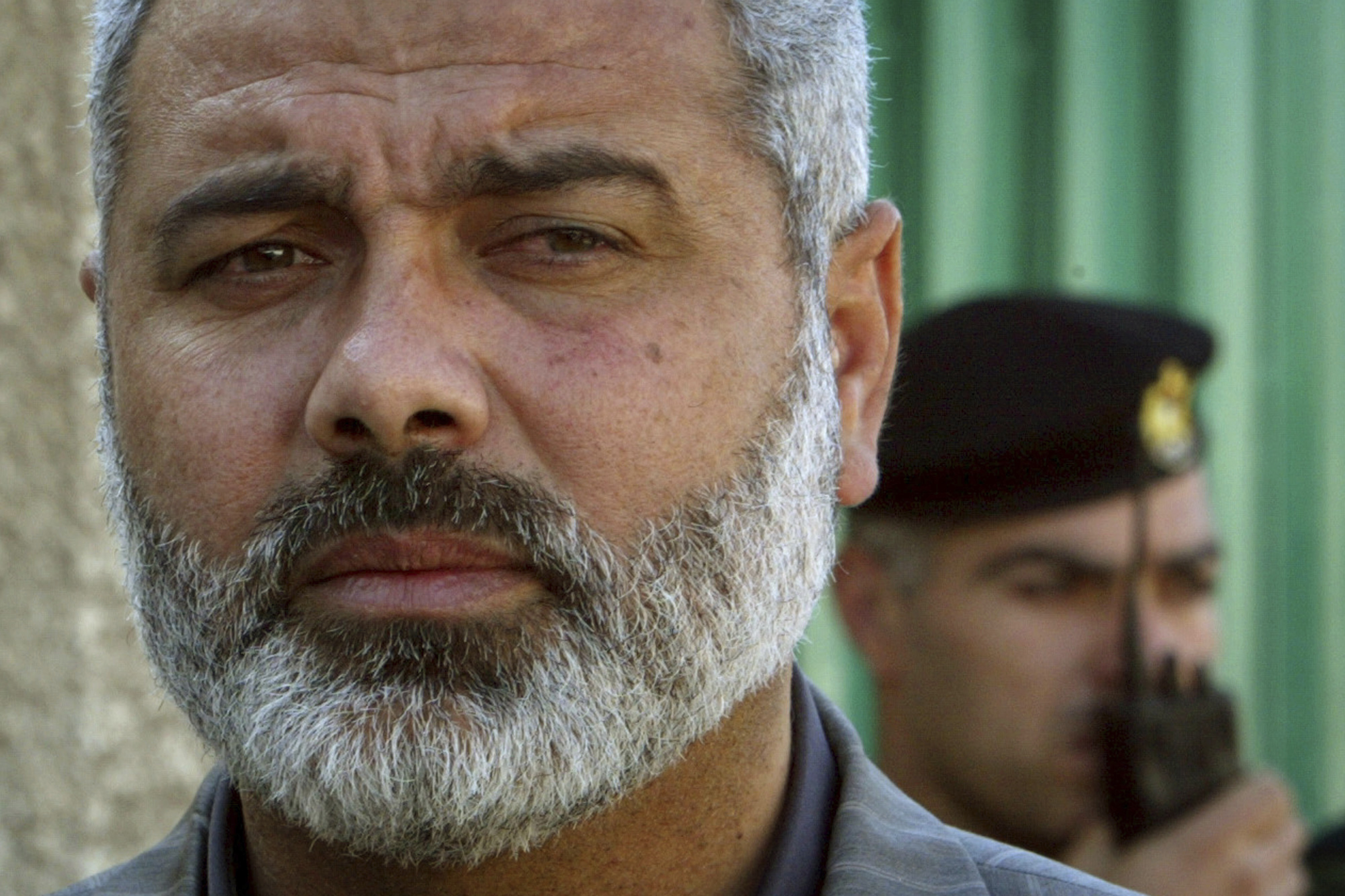 Palestinian Hamas leader Ismail Haniyeh speaks to the media