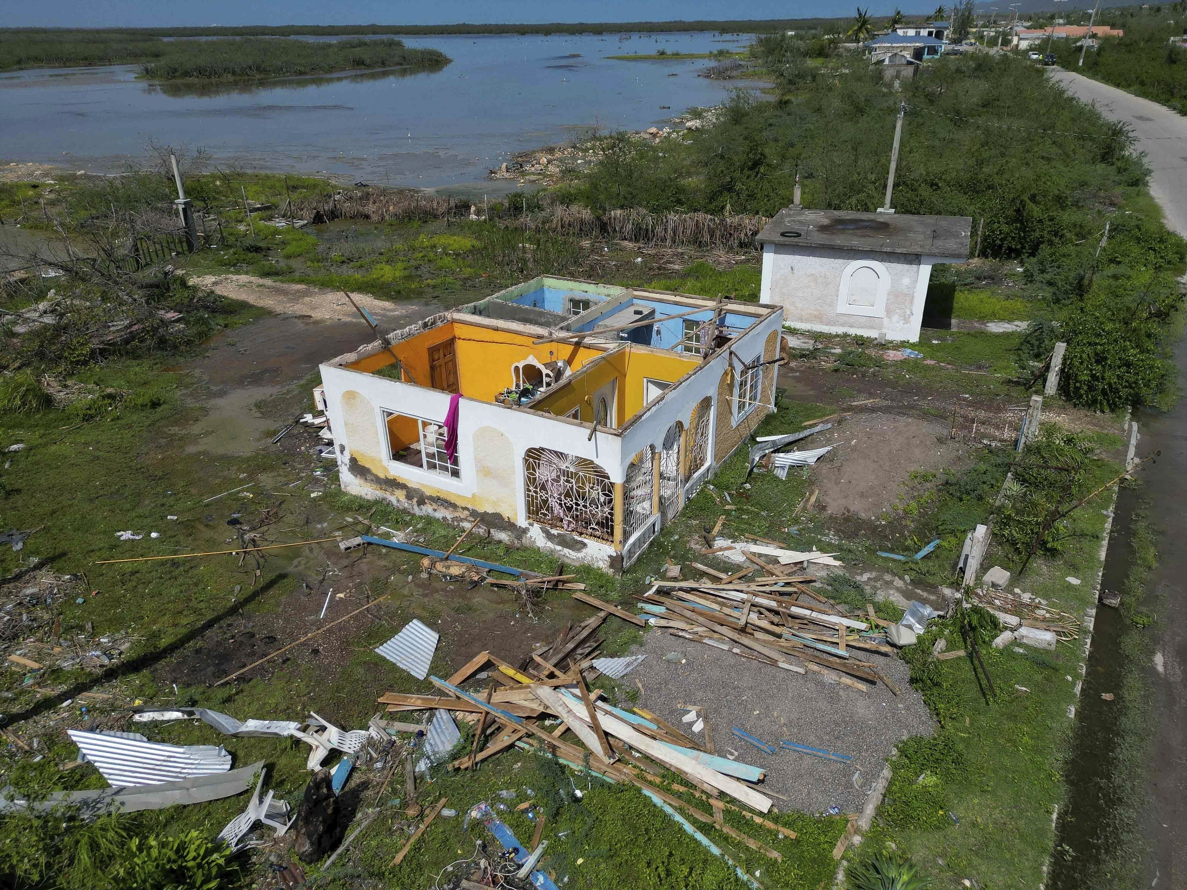 A house sits roofless after being damaged by Hurricane Beryl in Portland Cottage, Clarendon, Jamaica