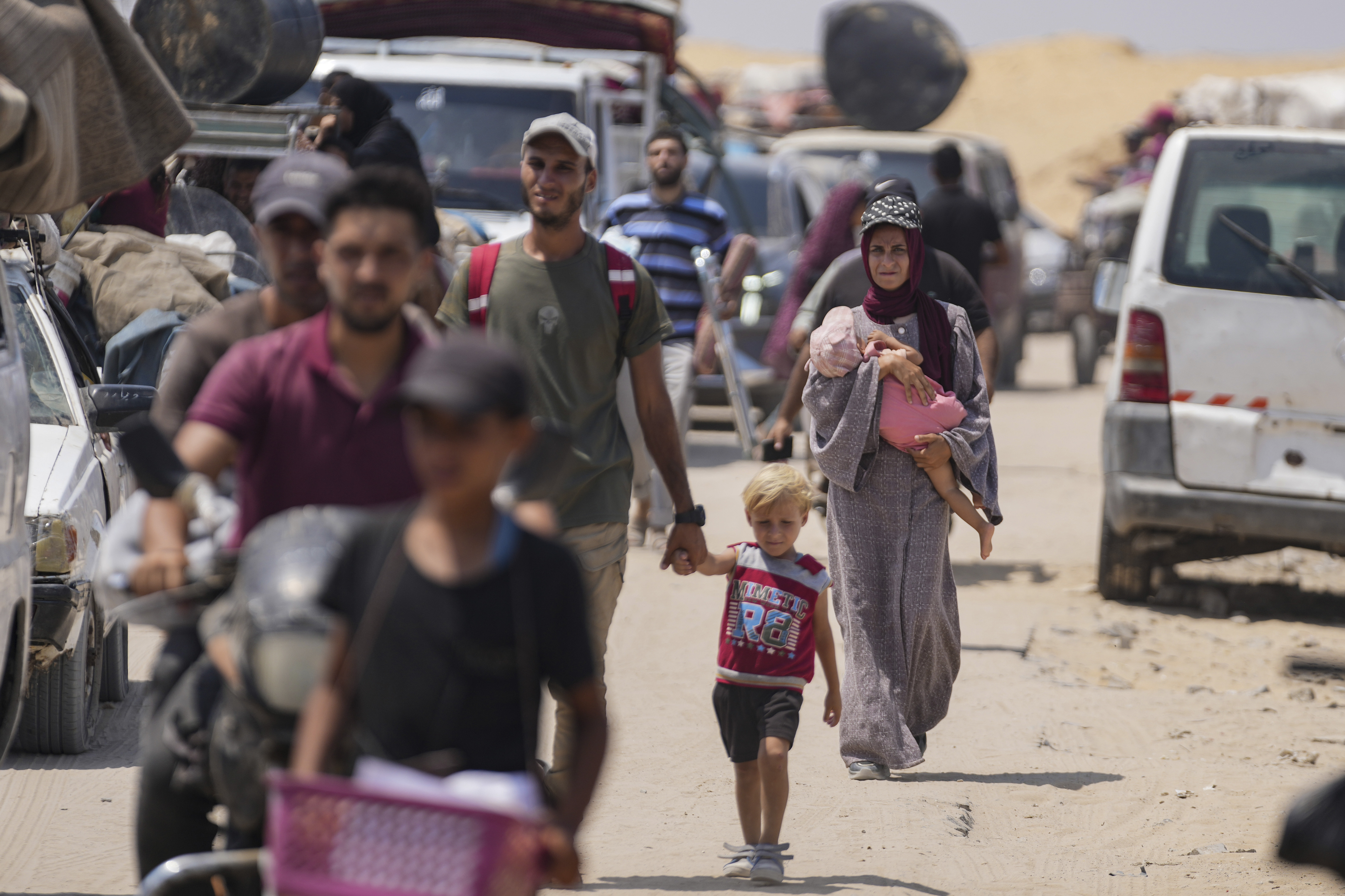 Palestinians displaced by the Israeli air and ground offensive flee from parts of Khan Younis in southern Gaza after an evacuation order by the Israeli army