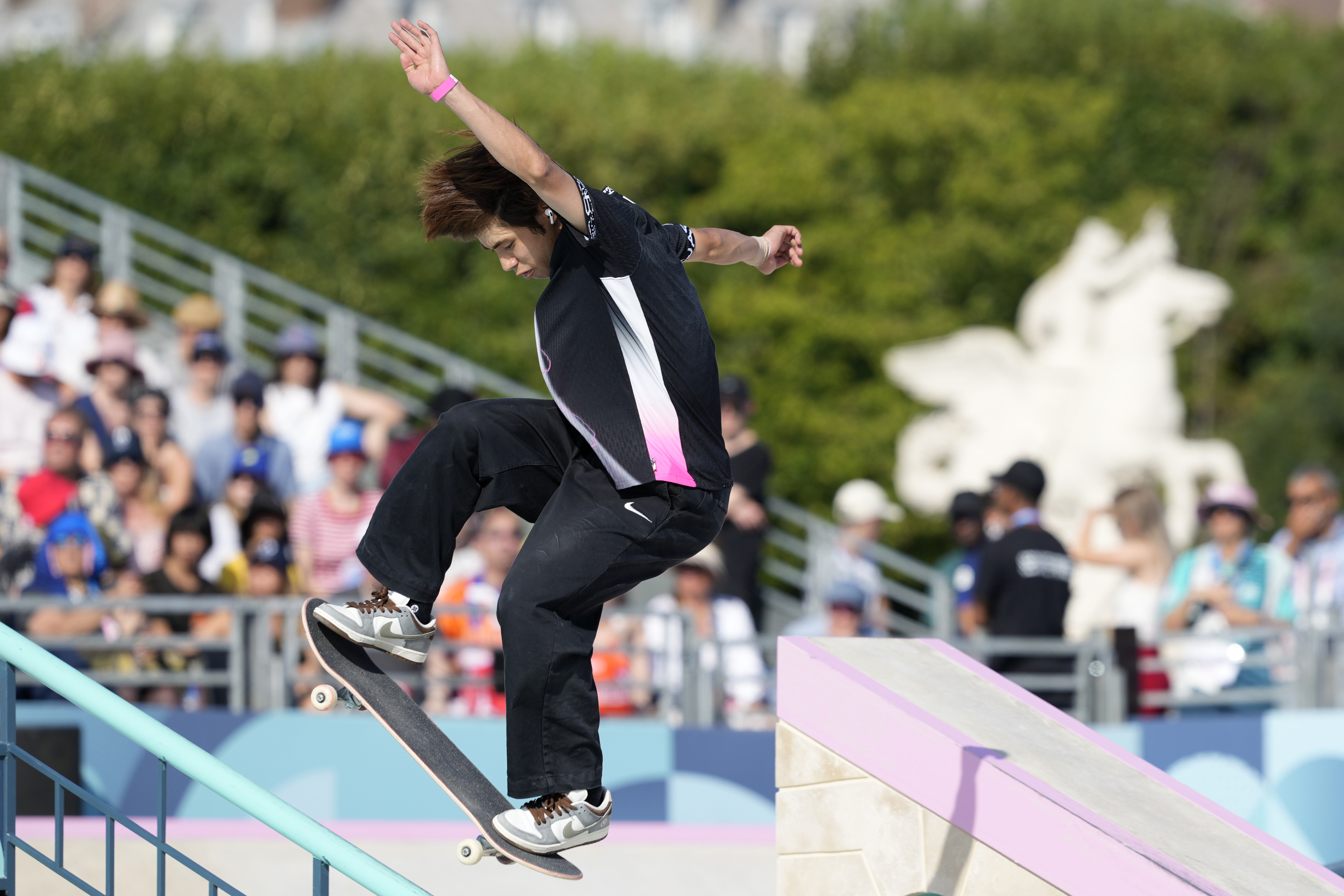 Yuto Horigome, of Japan, executes a trick during the men's skateboard street final at the 2024 Summer Olympics, Monday, July 29, 2024, in Paris, France. (AP Photo/Dar Yasin)