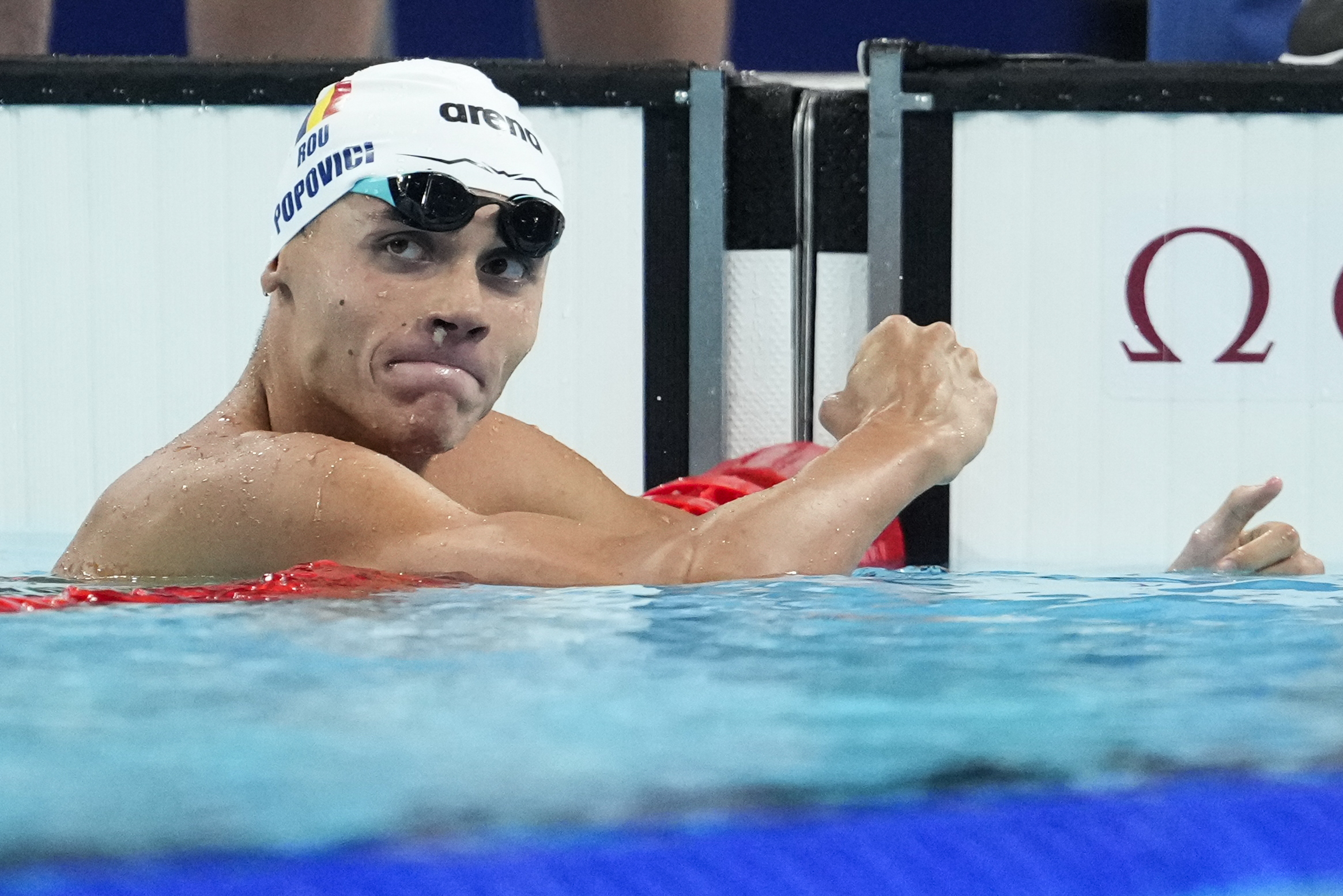 Romania's David Popovici beat Britain's Matt Richards by 0.02 of a second to win the men's 200 metres freestyle gold.