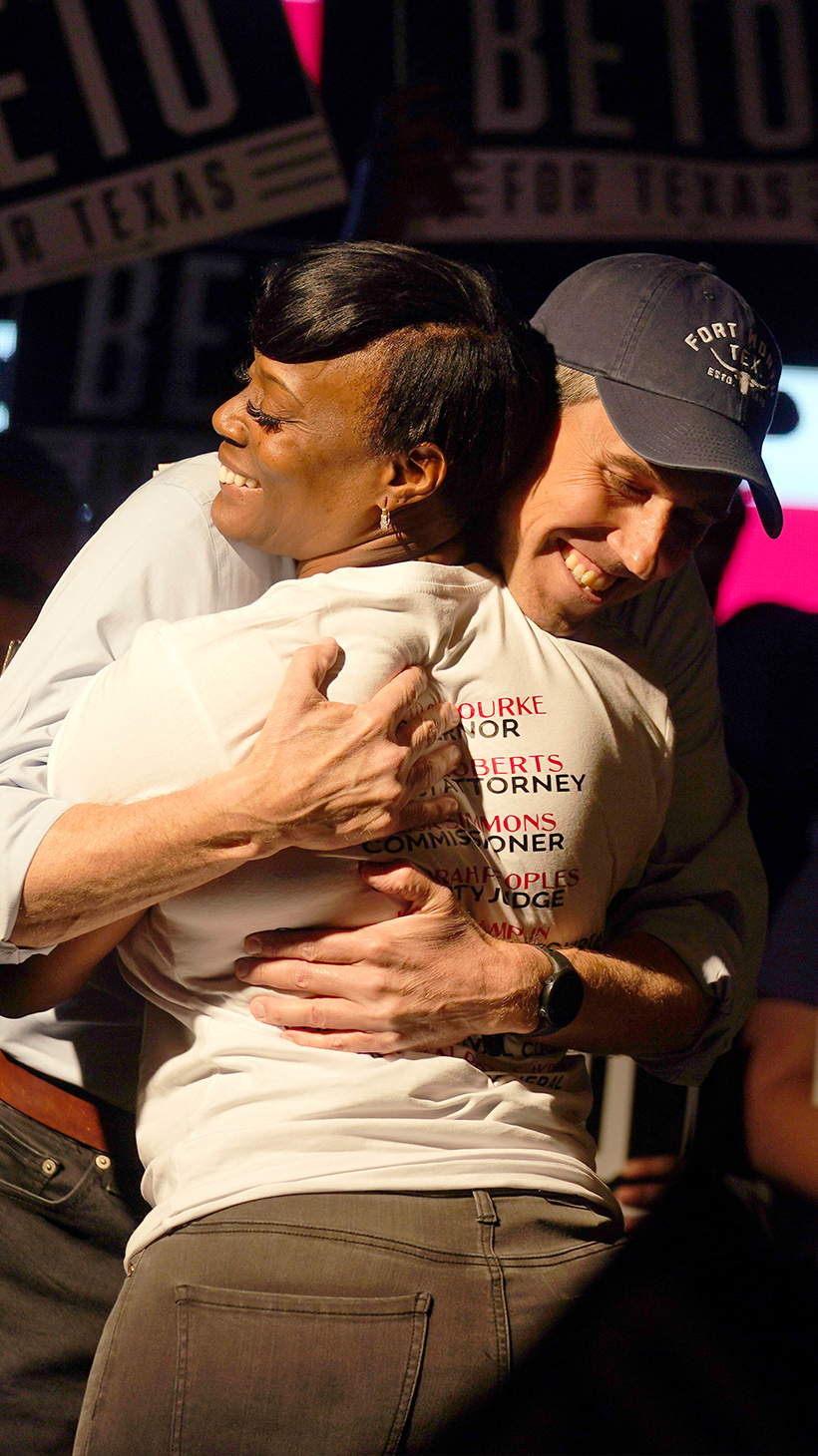 Beto O'Rourke hugs Crystal Mason on stage.