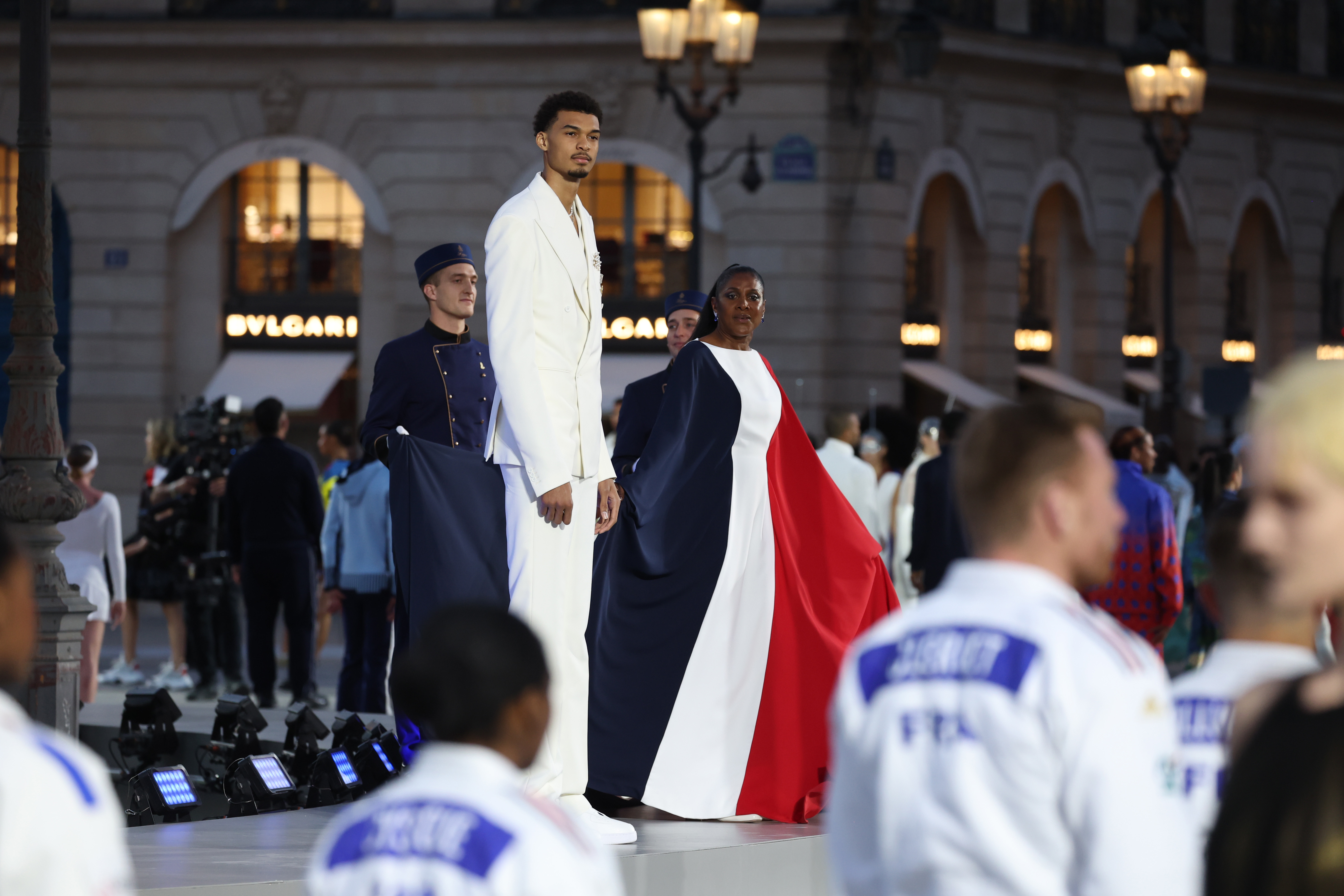 Athletes at fashion parade in Paris.
