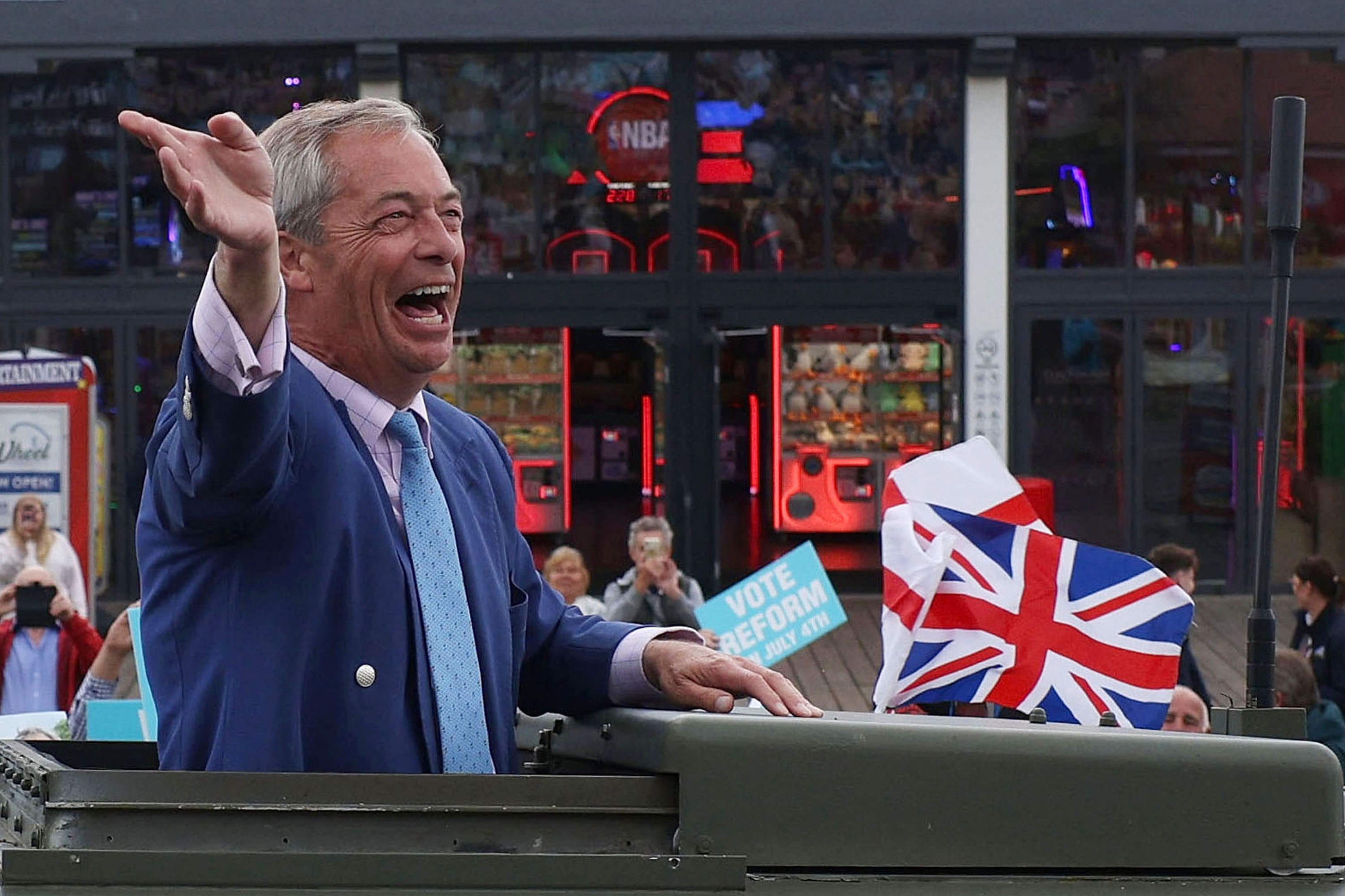 Reform UK party leader Nigel Farage speaks to the crowd as he arrives to deliver a speech to supporters on July 3, 2024 in Clacton-on-Sea, England the seat he as won as MP. [Dan Kitwood/Getty Images]