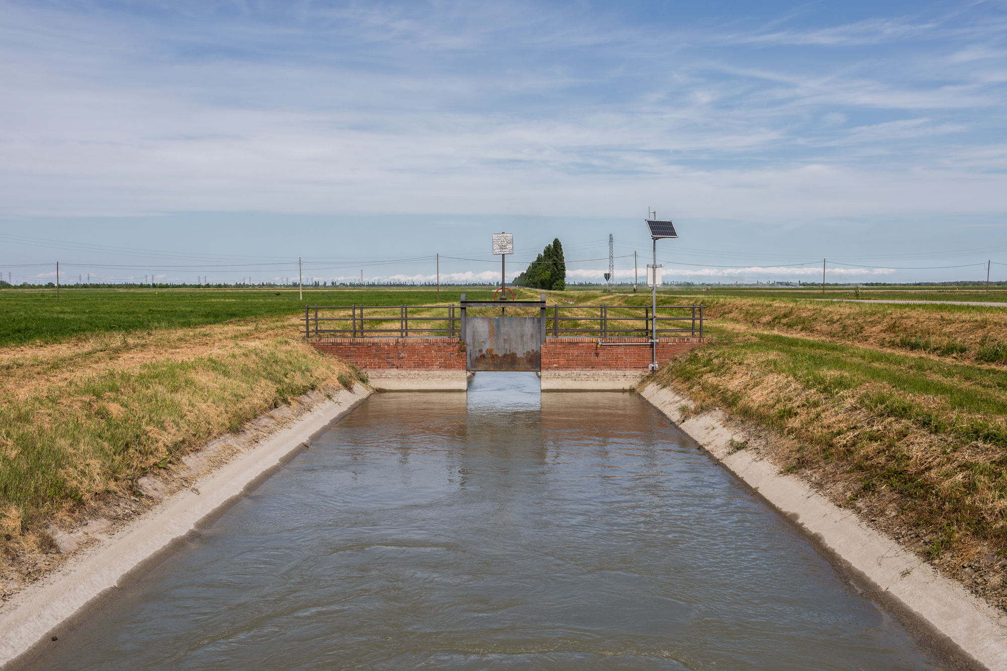 An irrigation canal in the countryside of Porto Tolle, Rovigo, Veneto. The system is equipped with a sensor for measuring water salinity which returns data in real-time to researchers