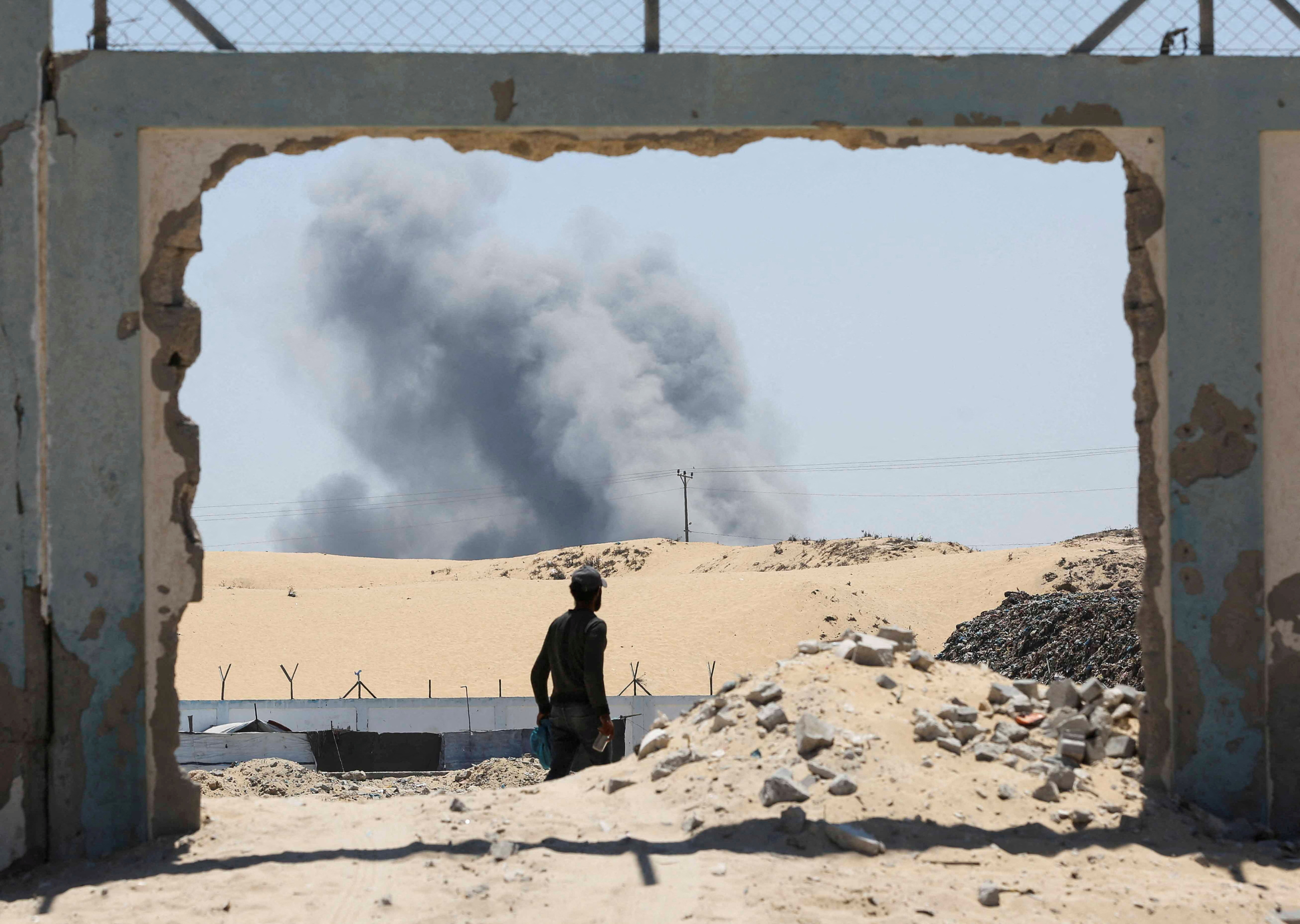 Smoke rises following Israeli strikes, in Khan Younis in the southern Gaza Strip August 8