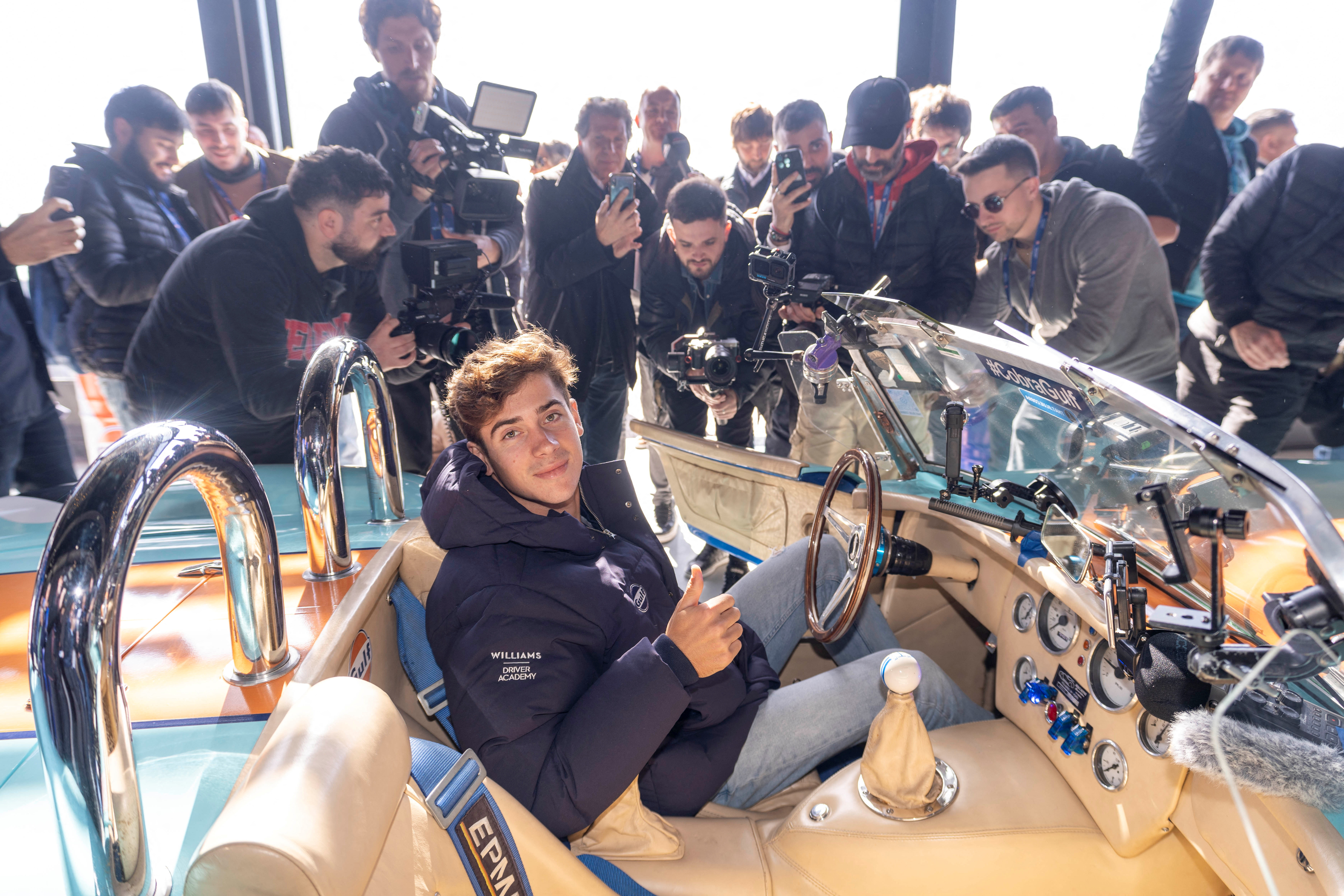 Franco Colapinto in car with media present.