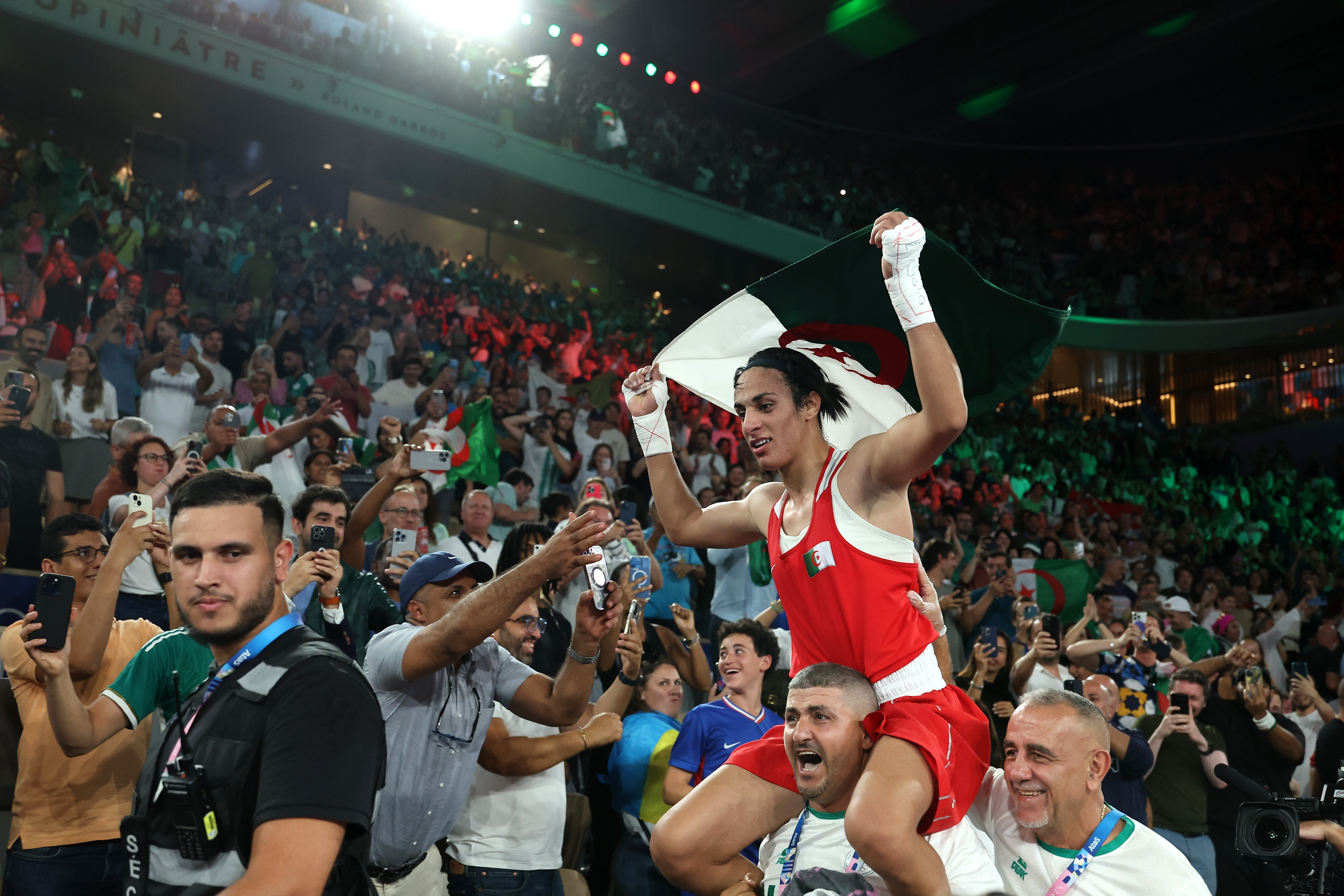 Boxer celebrates in crowd.