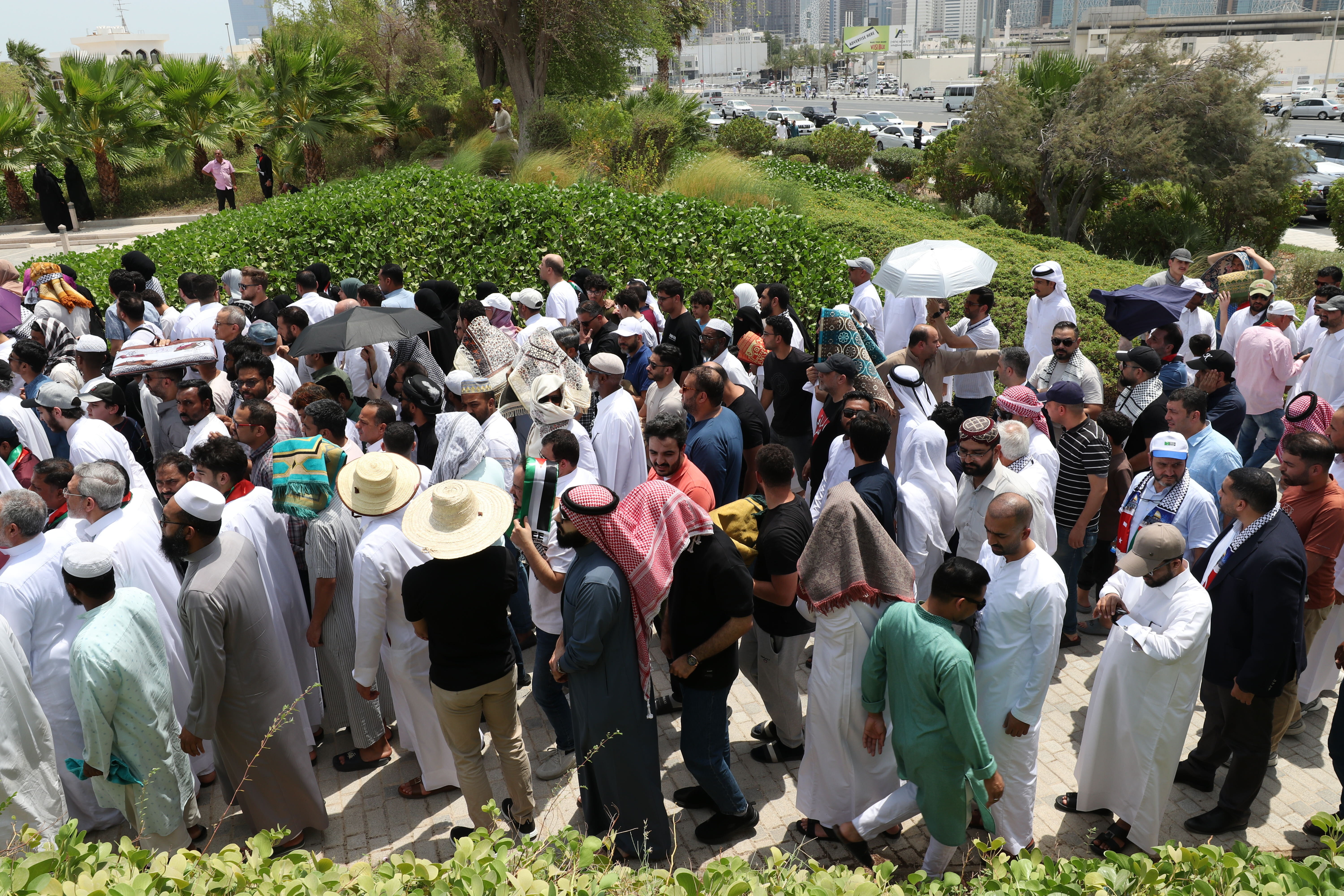 People gather at Imam Muhammad ibn Abd al-Wahhab Mosque in Doha for Friday prayer before the burial of Hamas leader Ismail Haniyeh [Showkat Shafi/Al Jazeera]