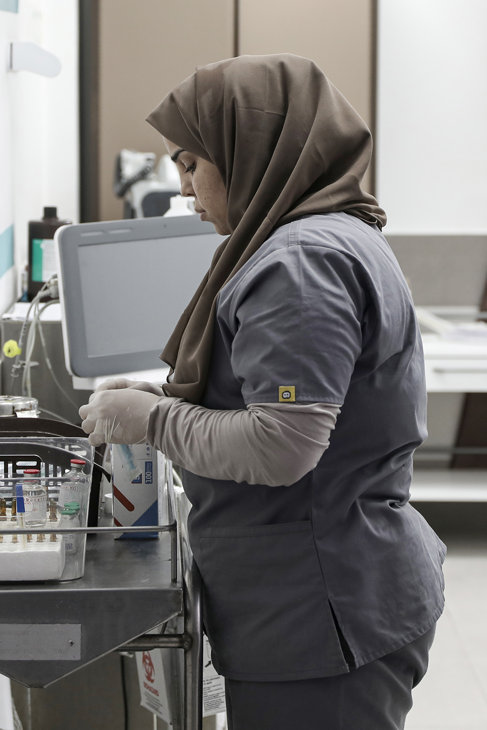 Gaza midwife [Abdelhakim Abu Riash/Al Jazeera]