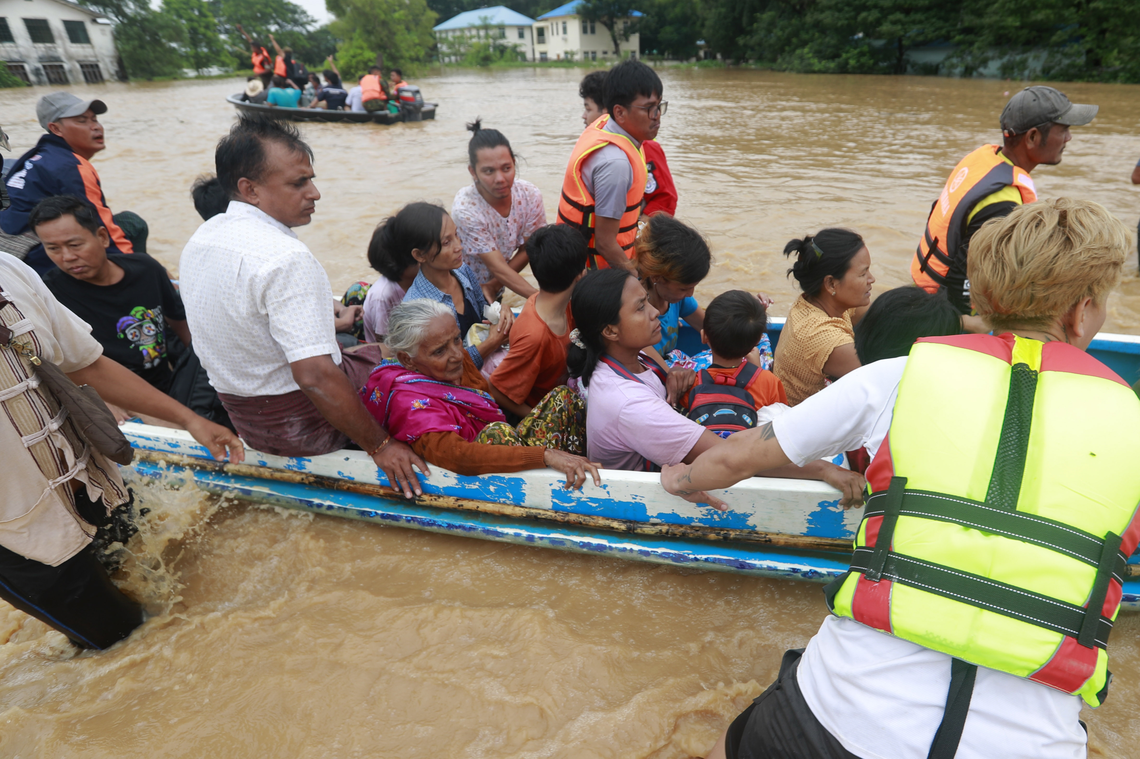 Rescue volunteers evacuate flood victims in Taungoo, Bago division, Myanmar, 14 September 2024. Heavy rains triggered by Typhoon Yagi have caused severe flooding in parts of Myanmar, leaving thousands stranded in their homes, with further heavy rainfall and thunderstorms expected, according to the state weather office. A statement from the Military announced 59,413 households were affected in 34 townships and set up 187 relief camps for the 236,649 people. There were 33 casualties due to the flood in the country including the Naypyitaw. EPA-EFE/NYEIN CHAN NAING