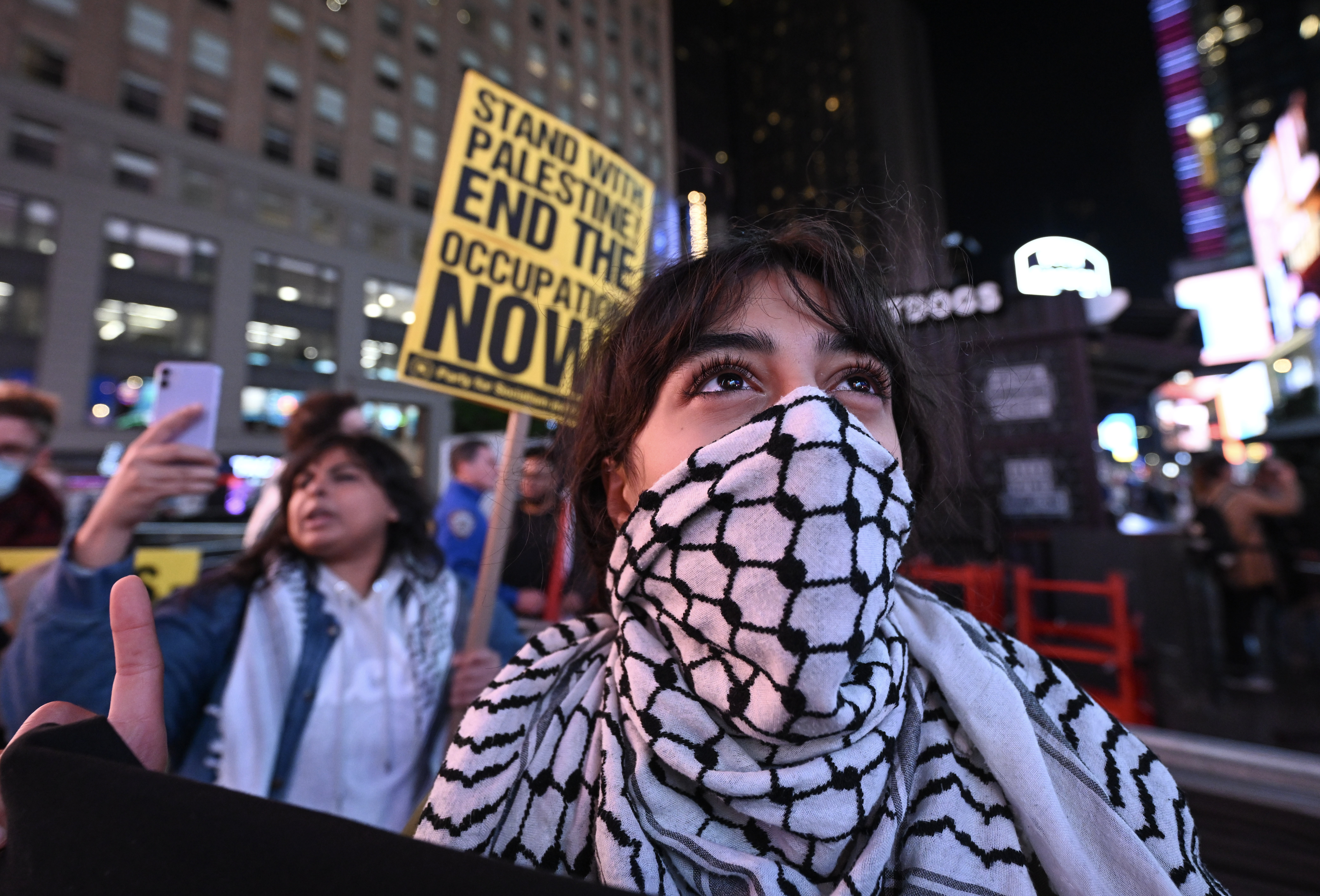 People protest in solidarity with the Palestinian and Lebanese people and to condemn the Israeli airstrikes in Lebanon and Gaza, in New York