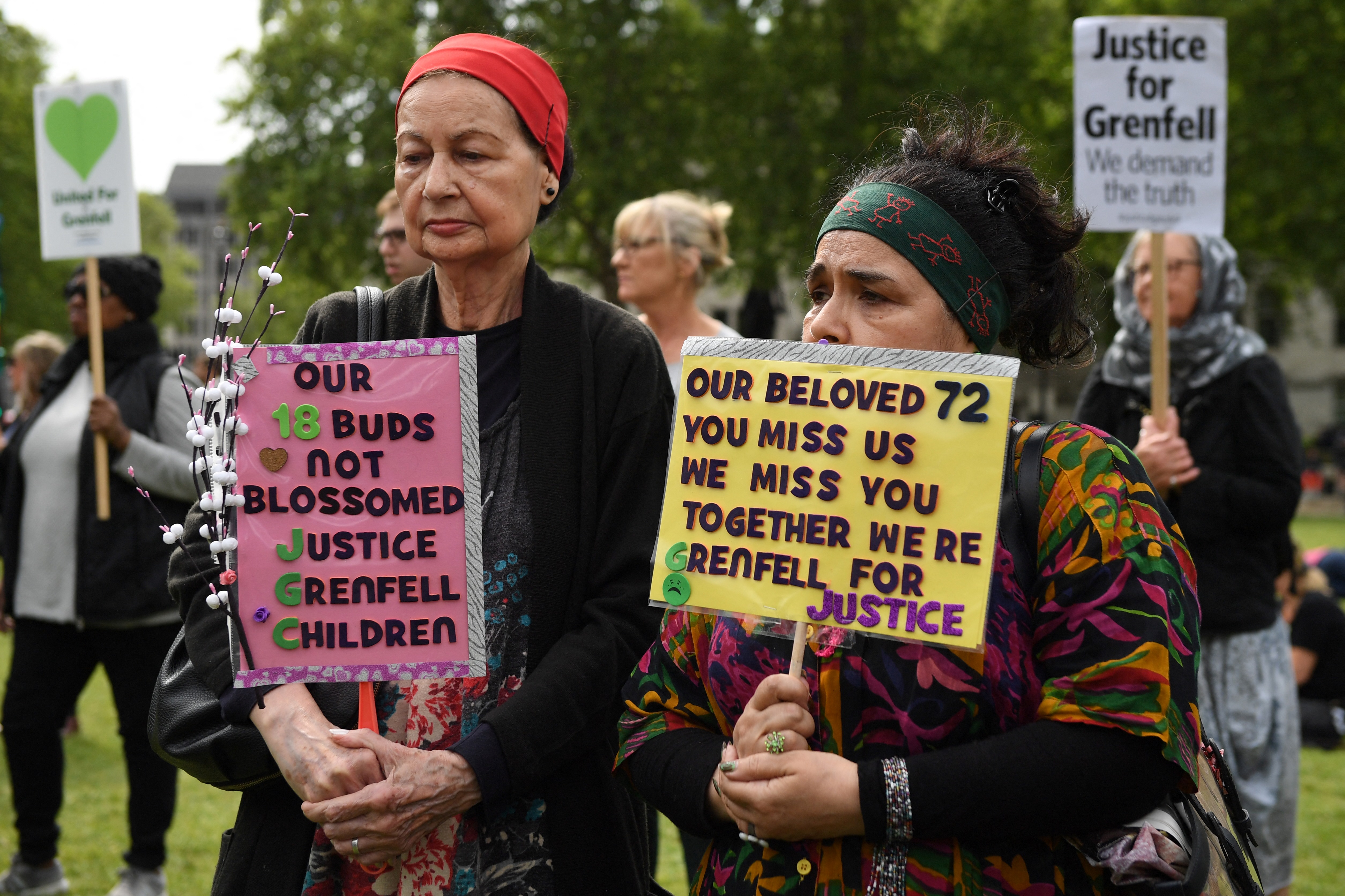 Demonstrators call for justice for the victims of the Grenfell Tower fire, during a protest opposite the Houses of Parliament in central London on May 14, 2018