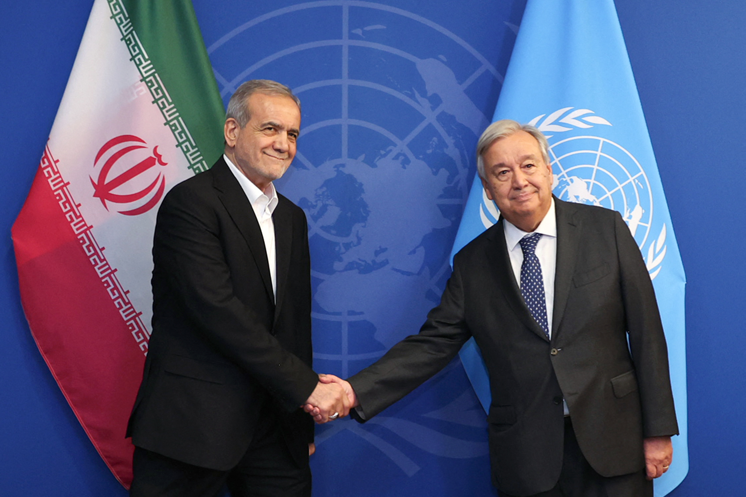 A handout picture provided by the Iranian presidency on September 24, 2024 shows President Masoud Pezeshkian (L) greets UN Secretary-General Antonio Guterres ahead of their meeting in New York. (Photo by Iranian Presidency / AFP) / === RESTRICTED TO EDITORIAL USE - MANDATORY CREDIT "AFP PHOTO / HO / IRANIAN PRESIDENCY" - NO MARKETING NO ADVERTISING CAMPAIGNS - DISTRIBUTED AS A SERVICE TO CLIENTS ===