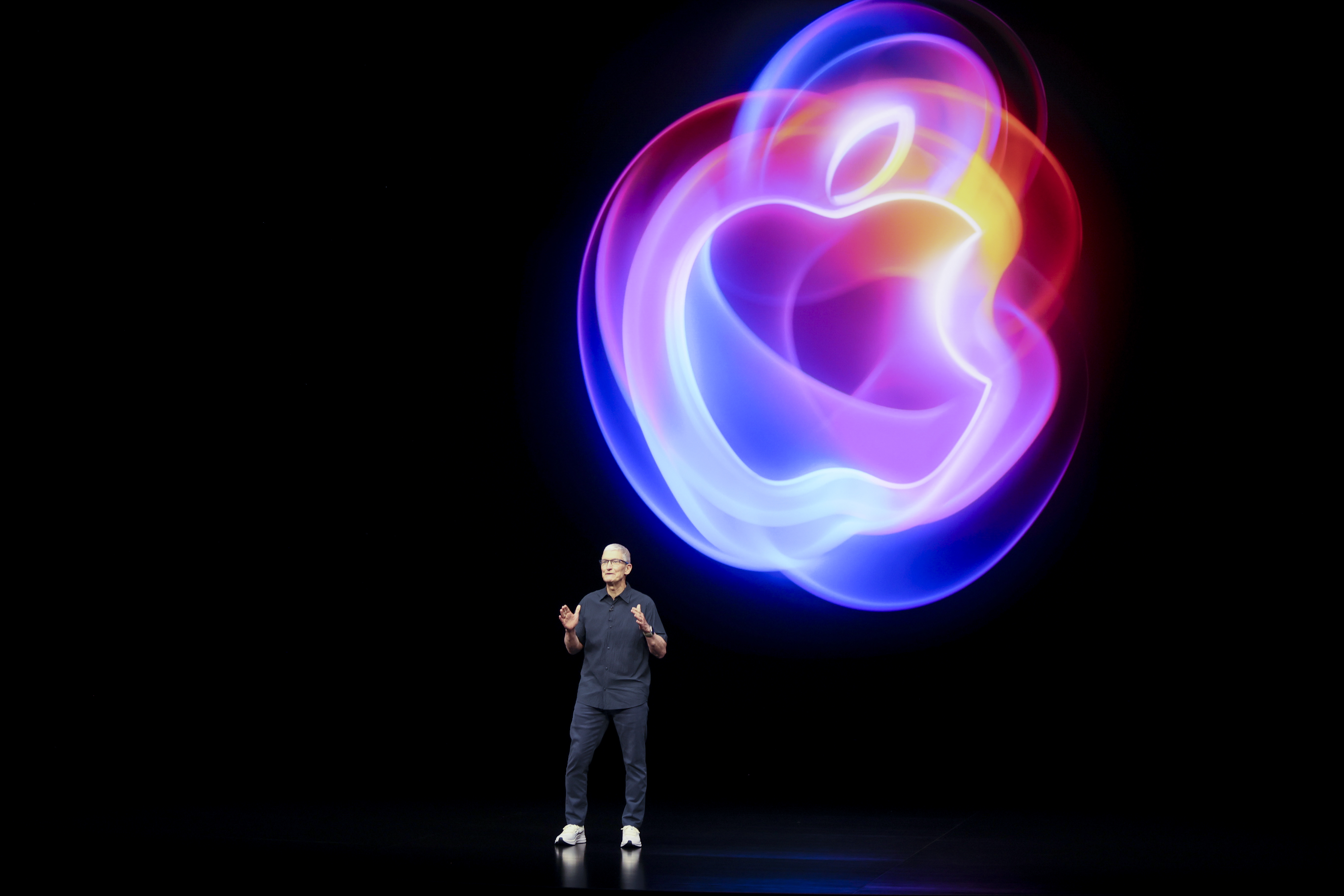 Apple CEO Tim Cook talks on the stage during an announcement of new products at Apple headquarters in Cupertino, California, US