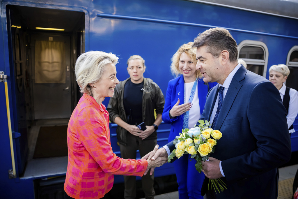 President of the European Commission, Ursula von der Leyen, left, is greeted as she arrives at the railway station in Kyiv, Ukraine