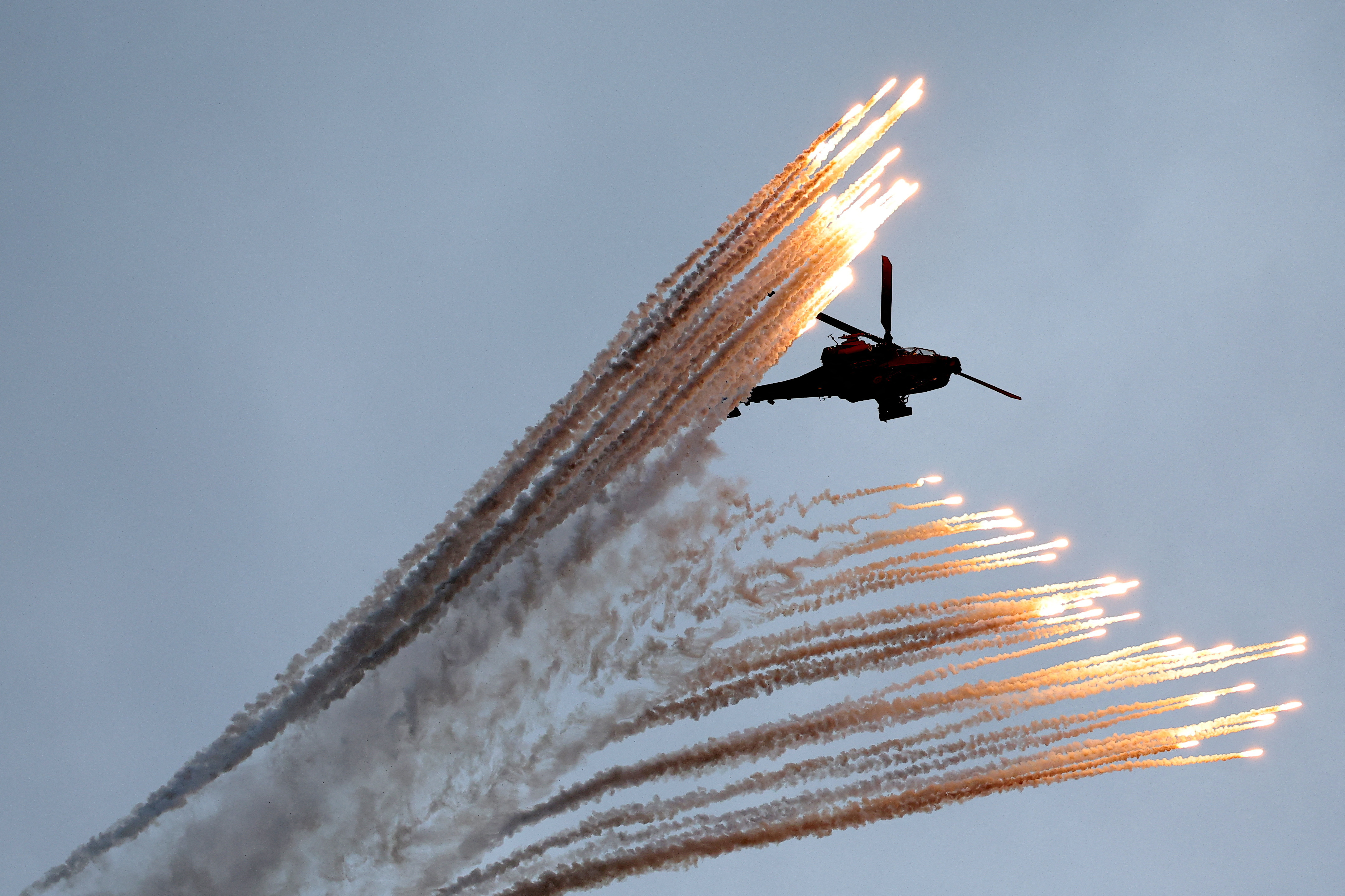 A South Korean army Apache helicopter firing multiple flares
