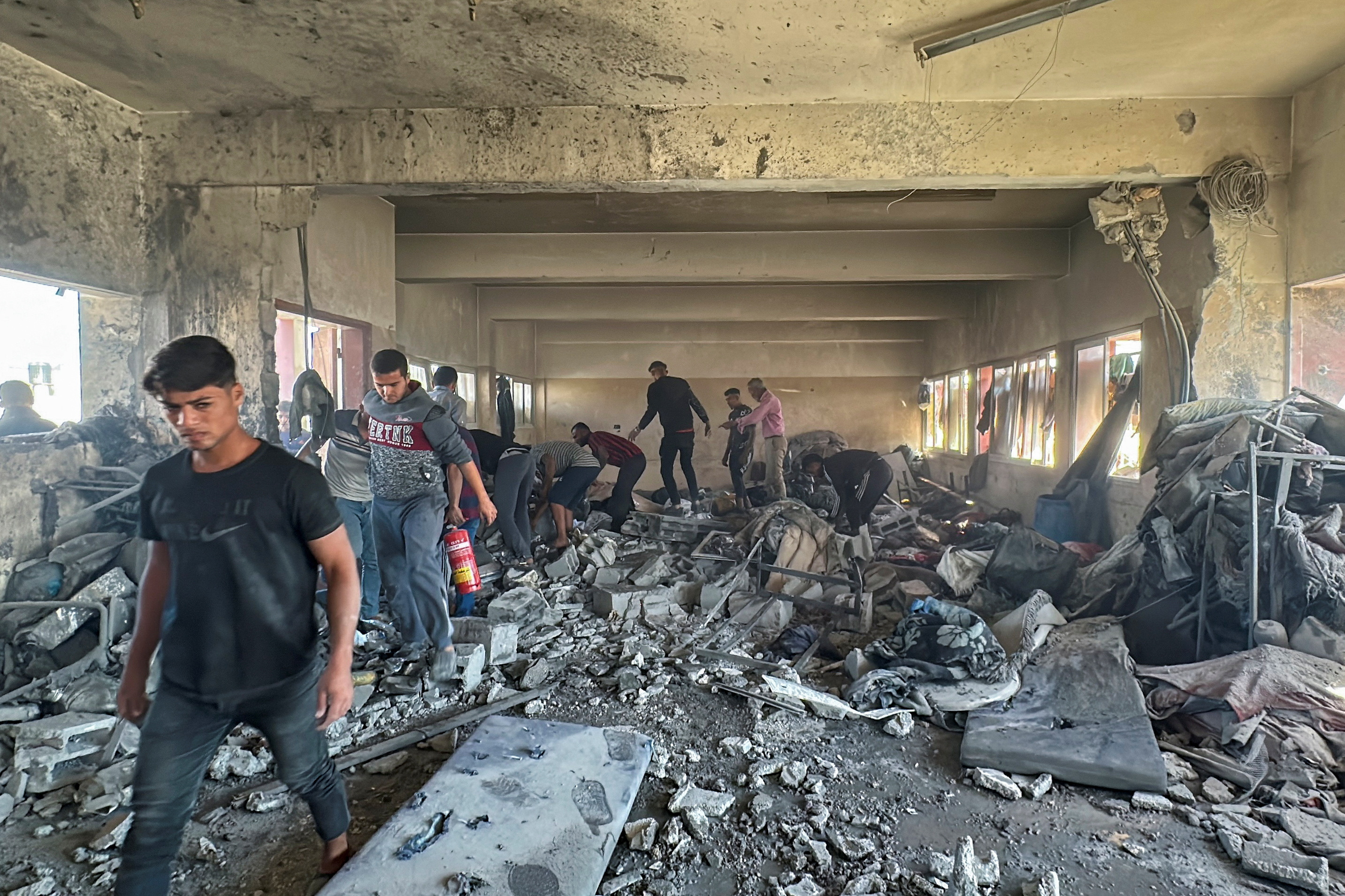 Smoke billows from a school sheltering displaced people following an Israeli strike