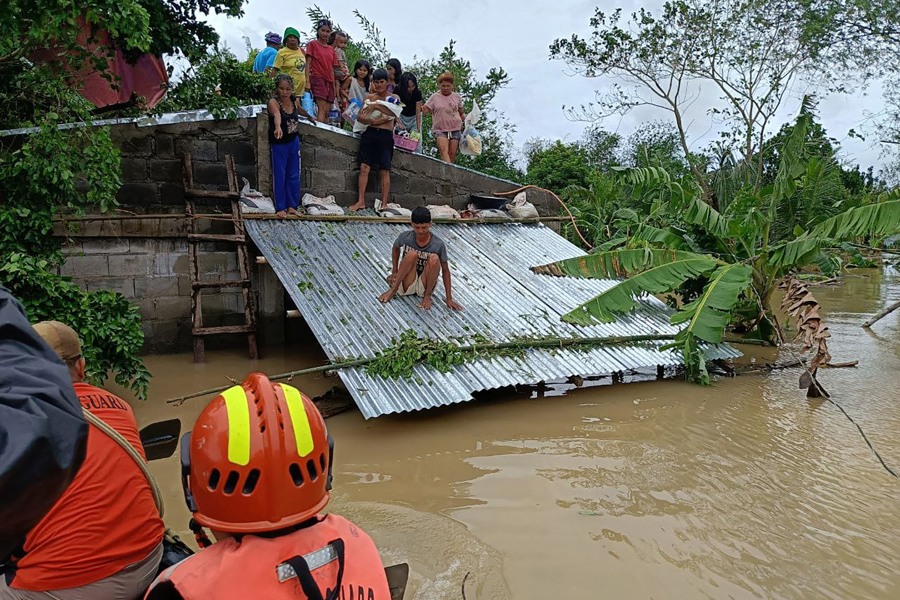 thousands evacuated as tropical storm batters Philippines